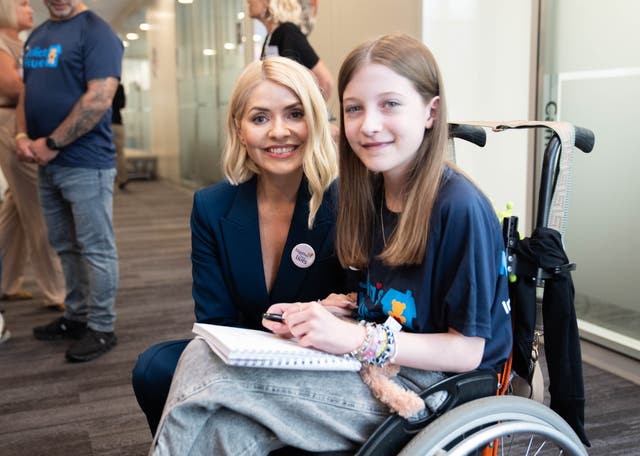 <p>Holly Willoughby meets 11-year-old Sophie Joscelyne during the BGC annual charity day (James Manning/PA)</p>