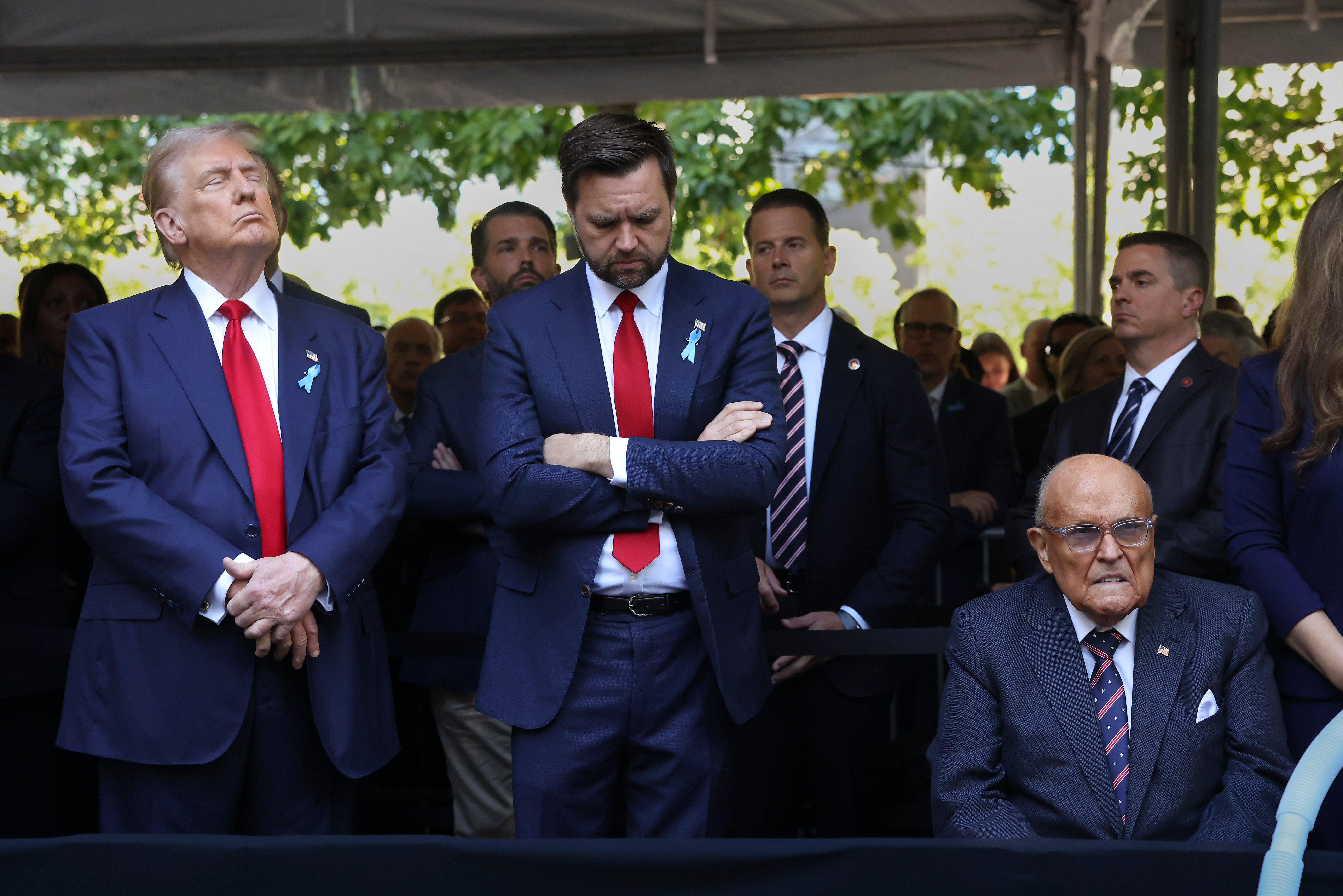 Republican presidential nominee former President Donald Trump, left, Republican vice presidential nominee Sen. JD Vance, R-Ohio, center, and Rudy Giuliani, right, attend the 9/11 Memorial ceremony on the 23rd anniversary of the Sept. 11, 2001 terror attacks, Wednesday, Sept. 11, 2024, in New York. (AP Photo/Yuki Iwamura)