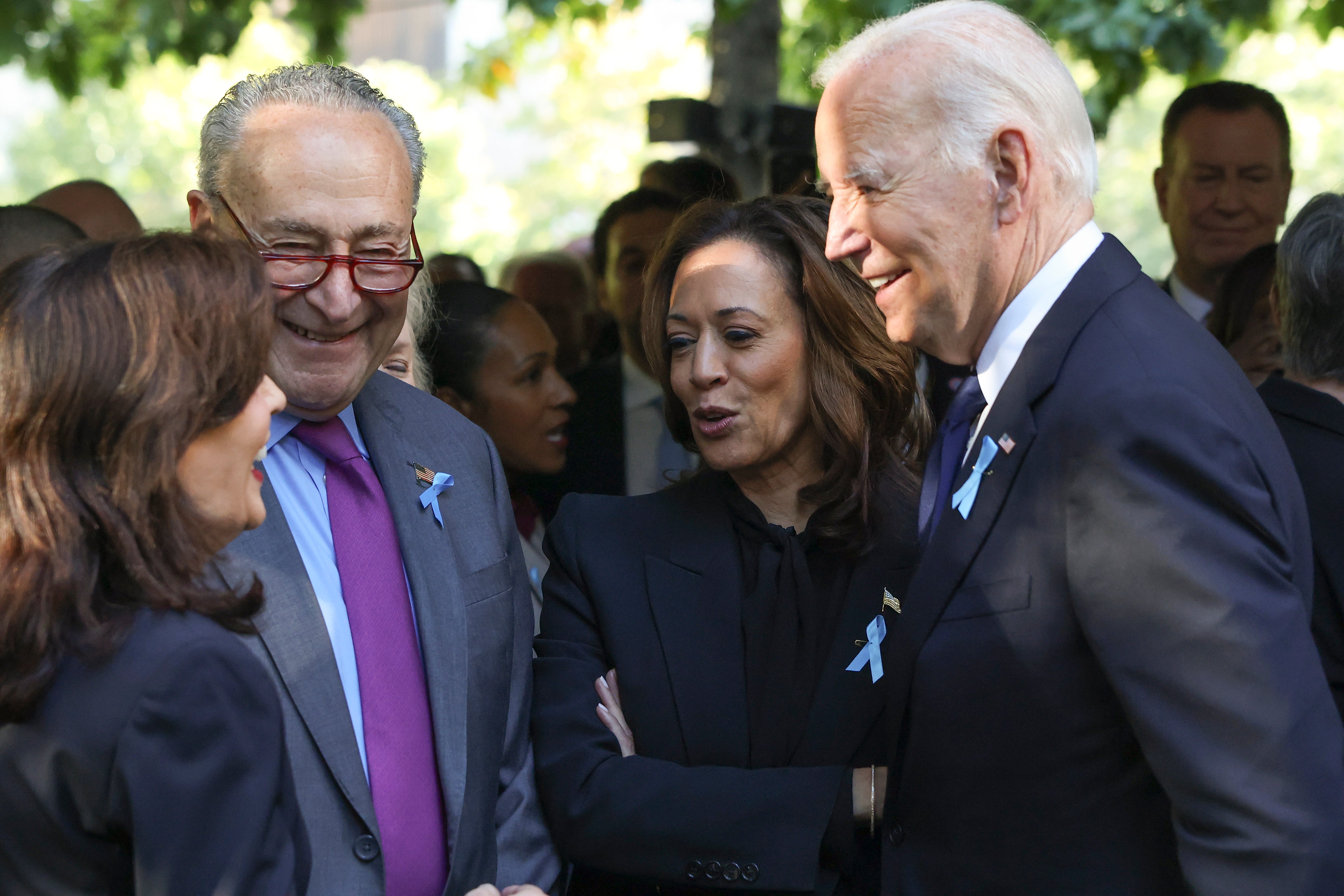 From left, New York Gov. Kathy Hochul, Sen. Chuck Schumer, D-NY, Democratic presidential nominee Vice President Kamala Harris and President Joe Biden talk while attending the 9/11 Memorial ceremony on the 23rd anniversary of the Sept. 11, 2001 terror attacks, Wednesday, Sept. 11, 2024, in New York. (AP Photo/Yuki Iwamura)