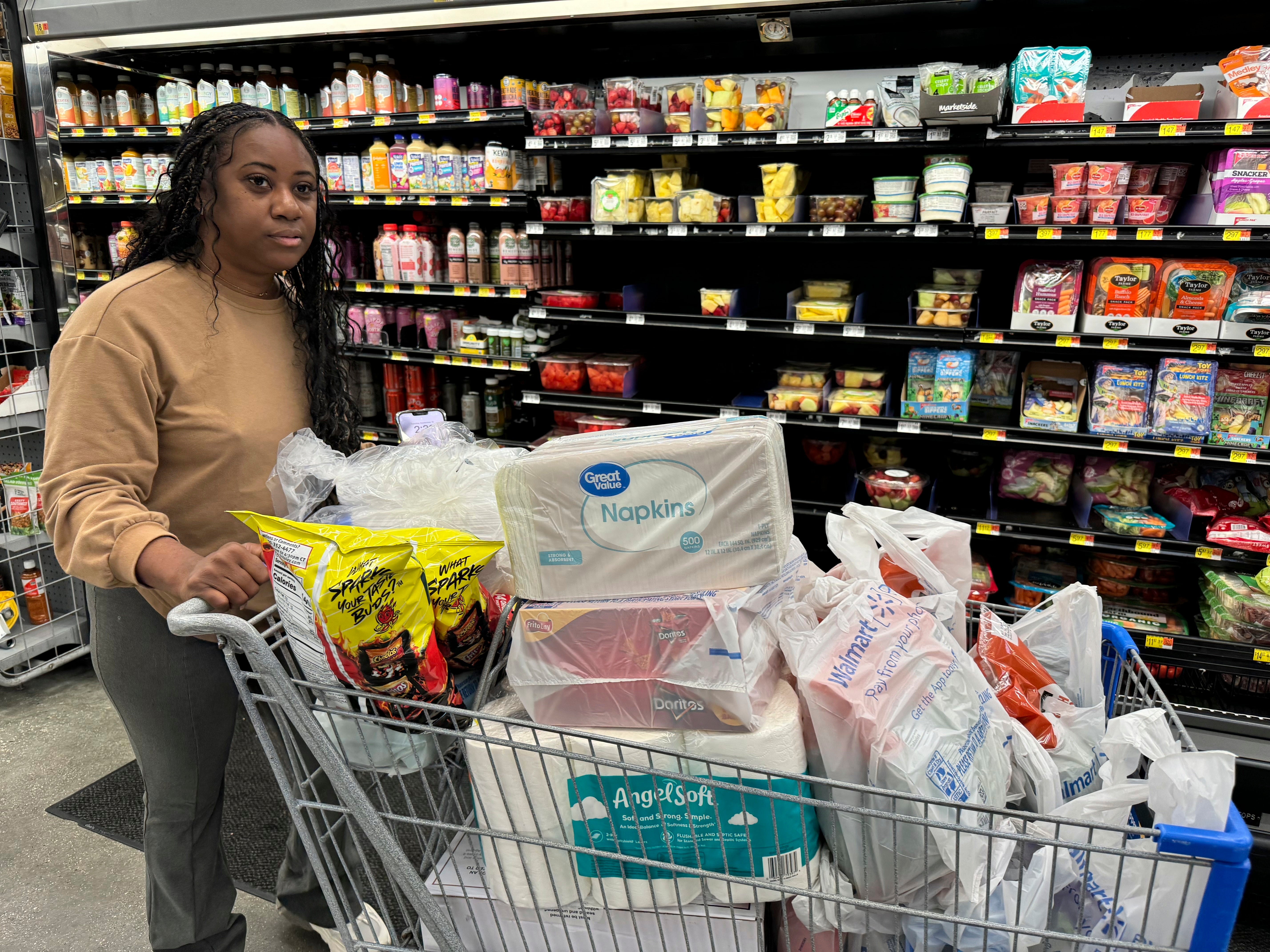 Roxanne Riley, 42, stocks up on supplies at a Walmart in New Orleans. Residents were sent scrambling to prepare for Francine before it became a hurricane.