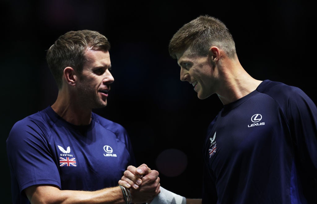 Harris celebrates with Leon Smith, Captain of Great Britain