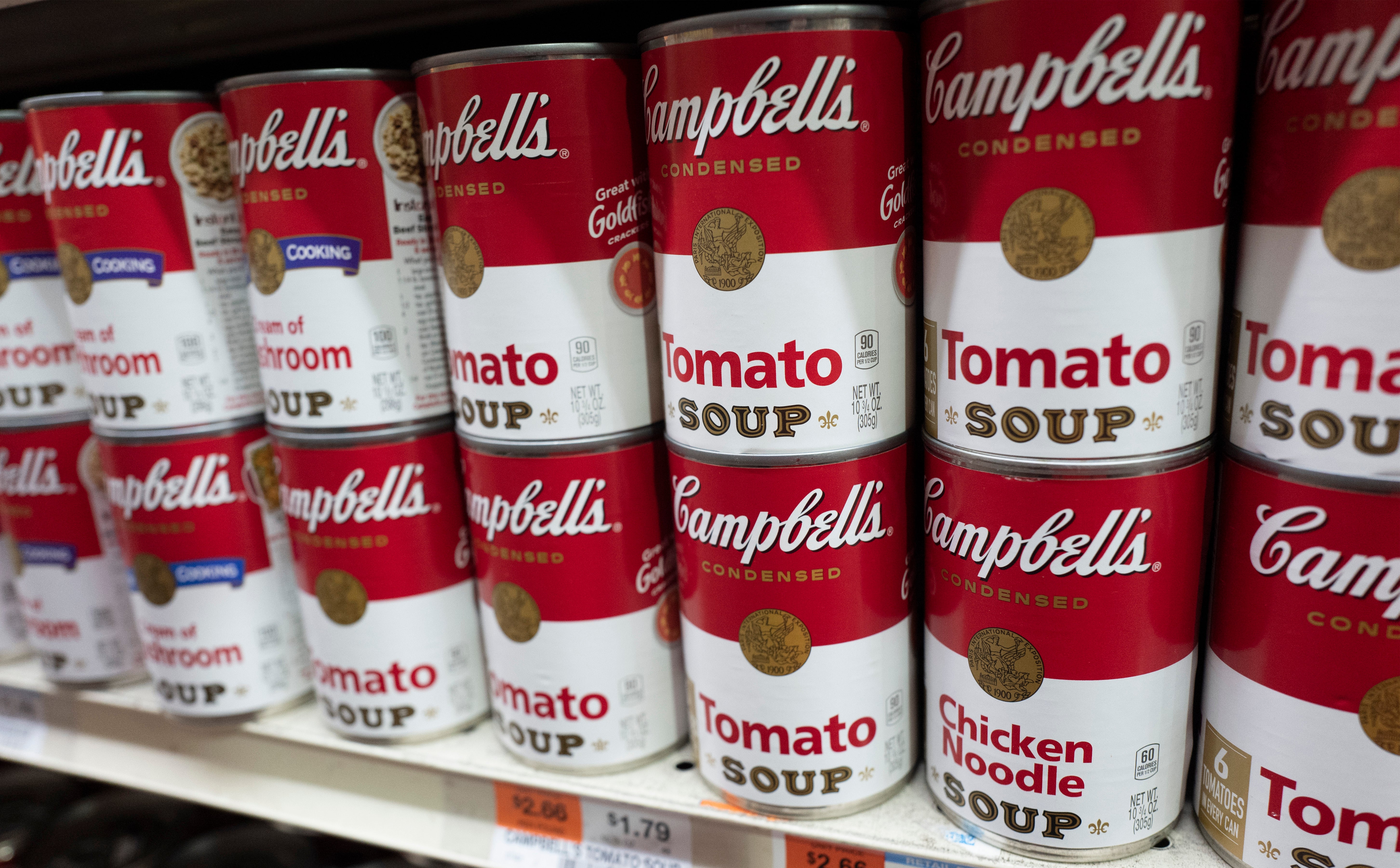 Cans of Campbell’s soup are displayed in a supermarket