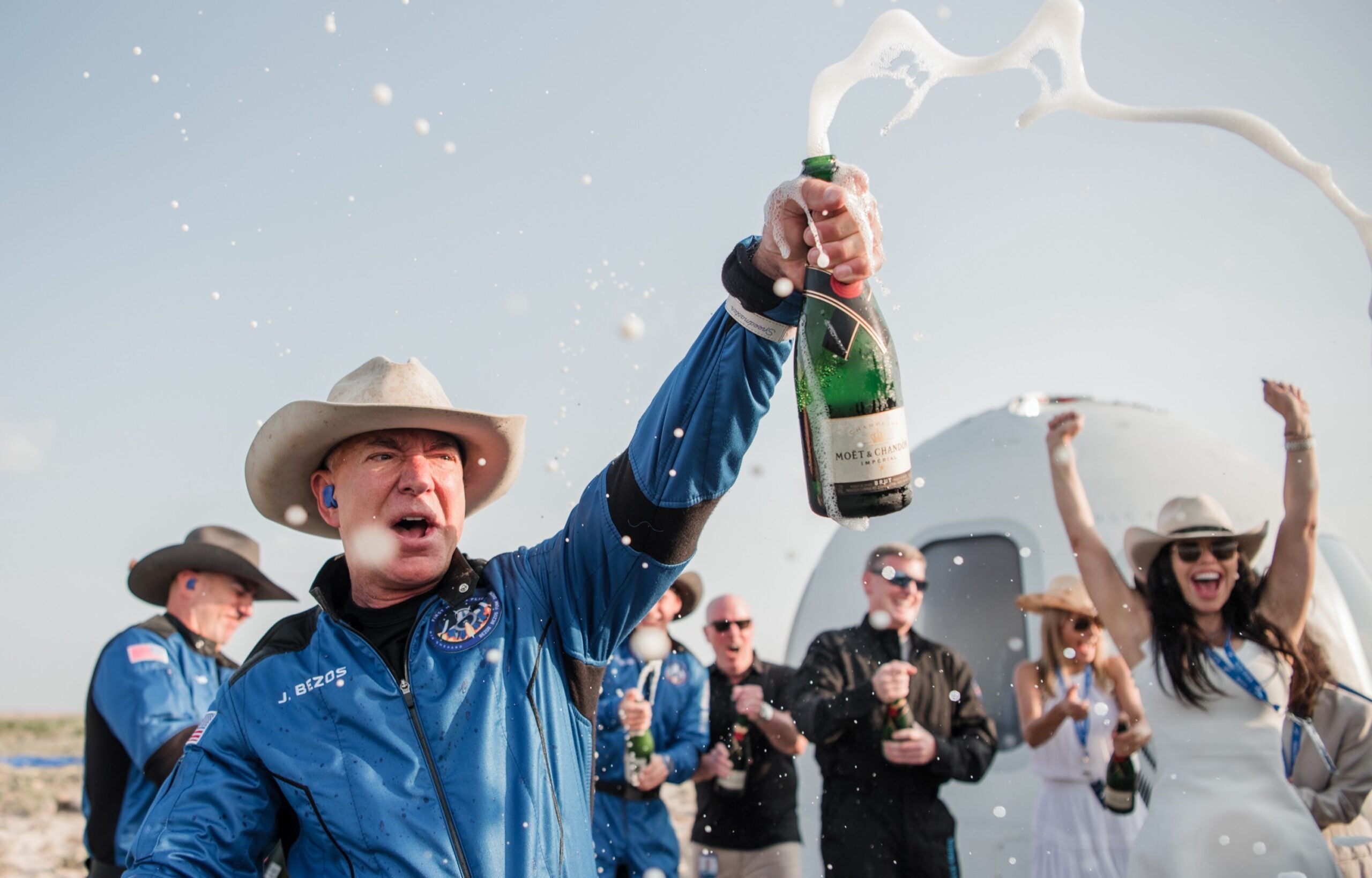 Jeff Bezos celebrates after touching down from a trip to the edge of space aboard a Blue Origin rocket in 2021