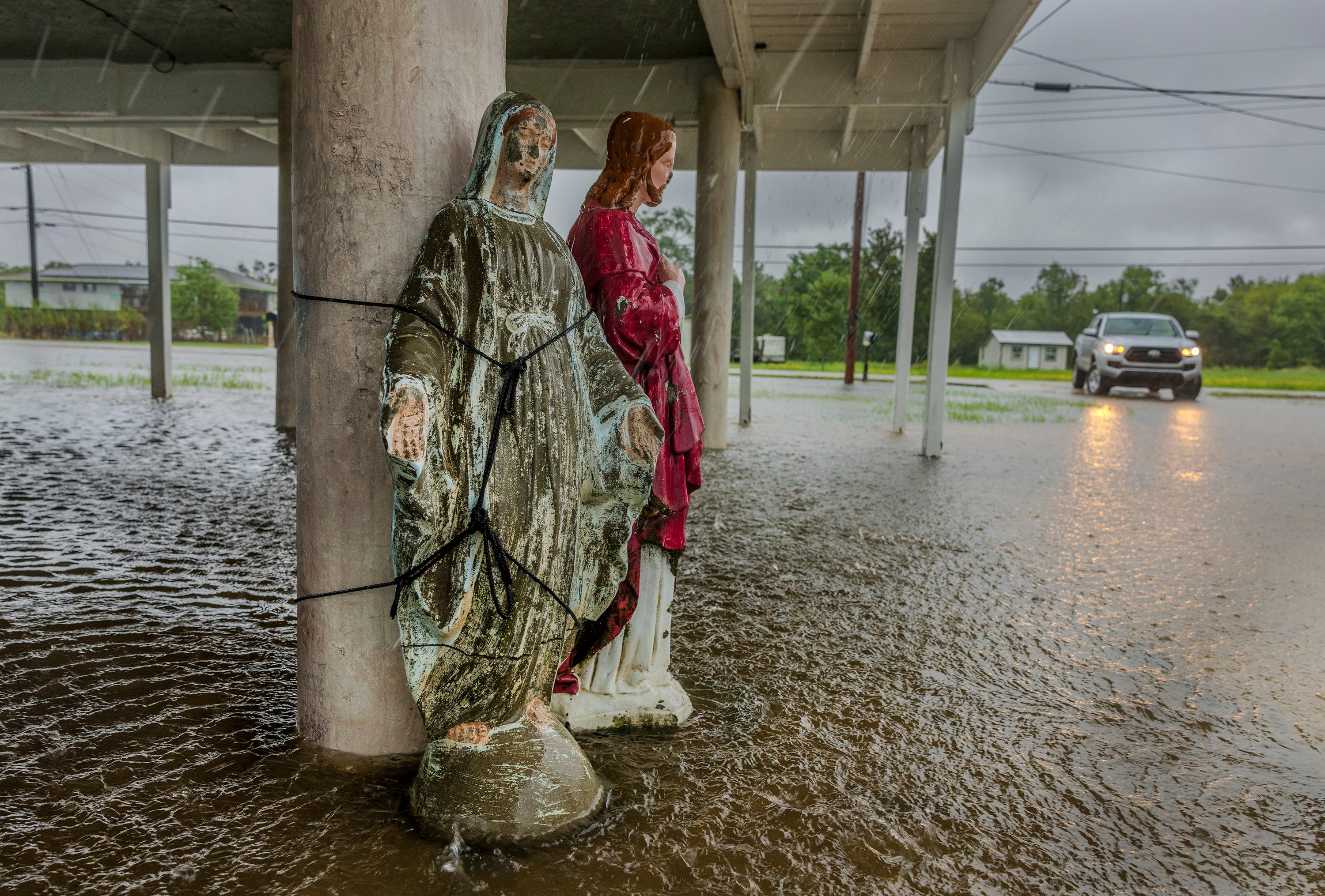 Floodwater from Hurricane Francine surrounds a statue of the Virgin Mary. The statue is tied to the support of an elevated home in Terrebonne Parish, Louisiana. Francine‘s northern eye wall was approaching the area..