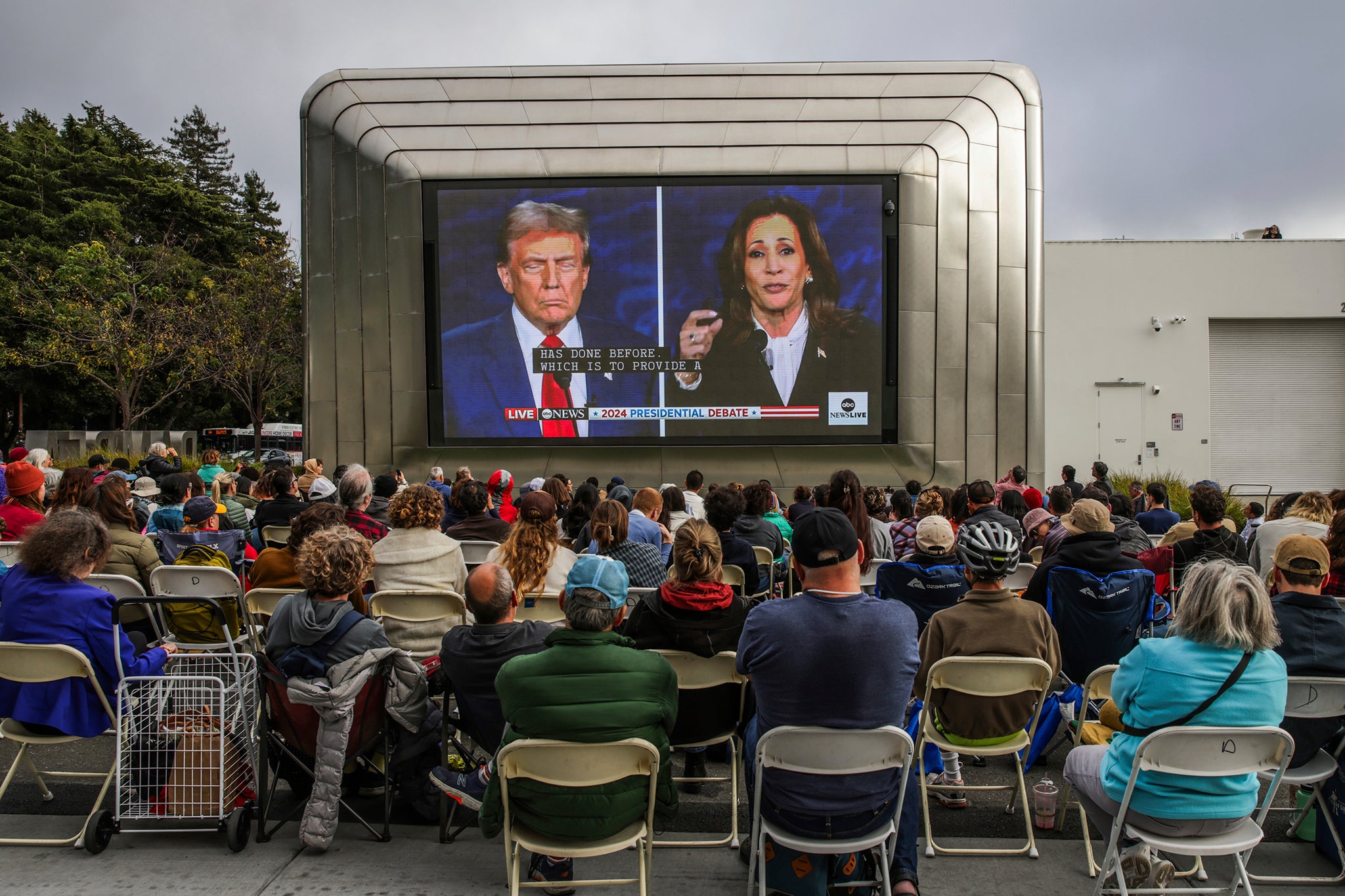 People gather outside of the Berkeley Art Museum and Pacific Film Archive to watch the presidential debate between Kamala Harris and Donald Trump