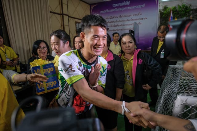 <p>File: Ekkapol Chantawong shakes hands with followers after the press conference since he and his players were rescued from a cave in northern Thailand</p>