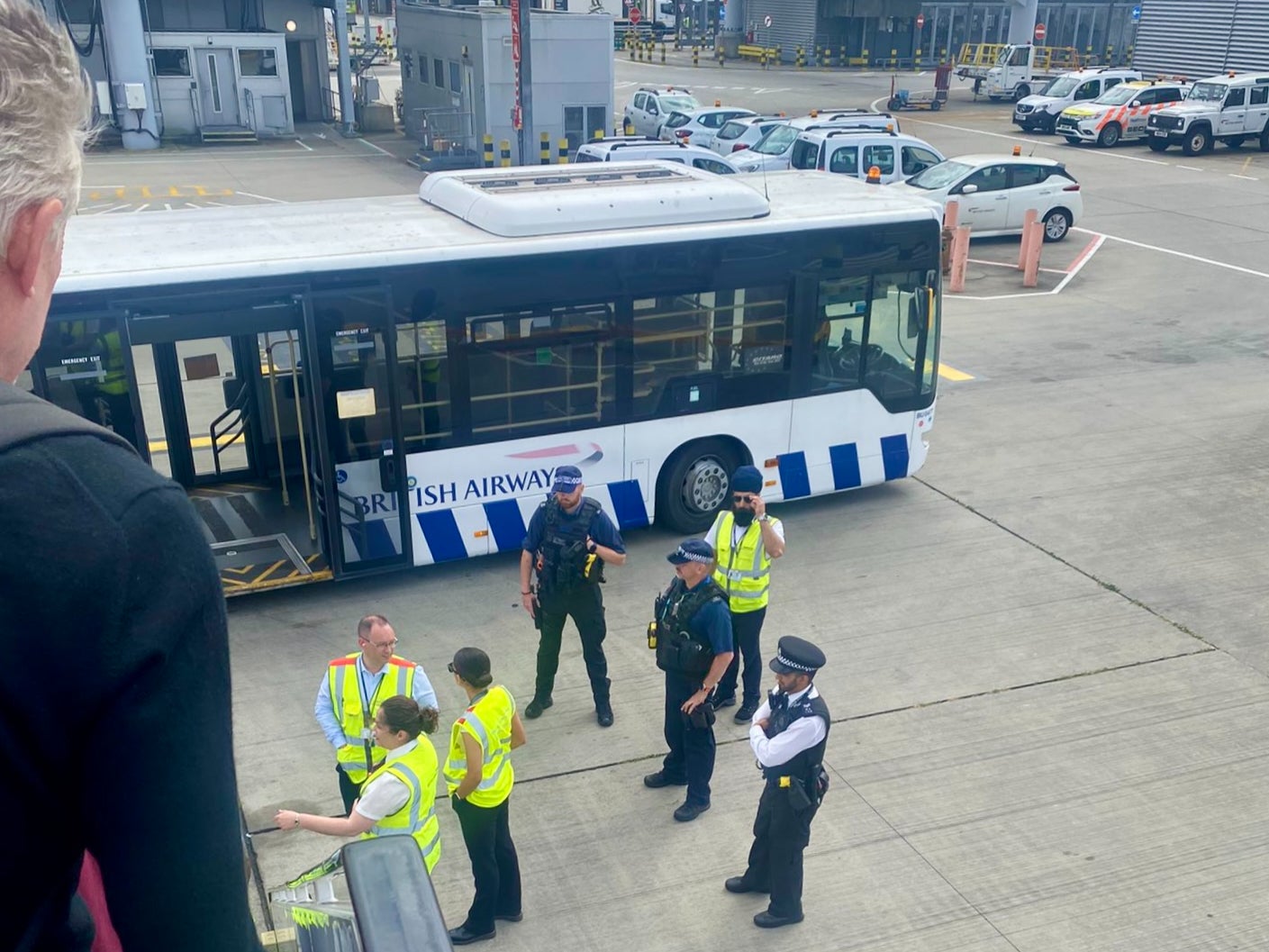 Wrong airport: British Airways staff and police outside the diverted BA Airbus A321