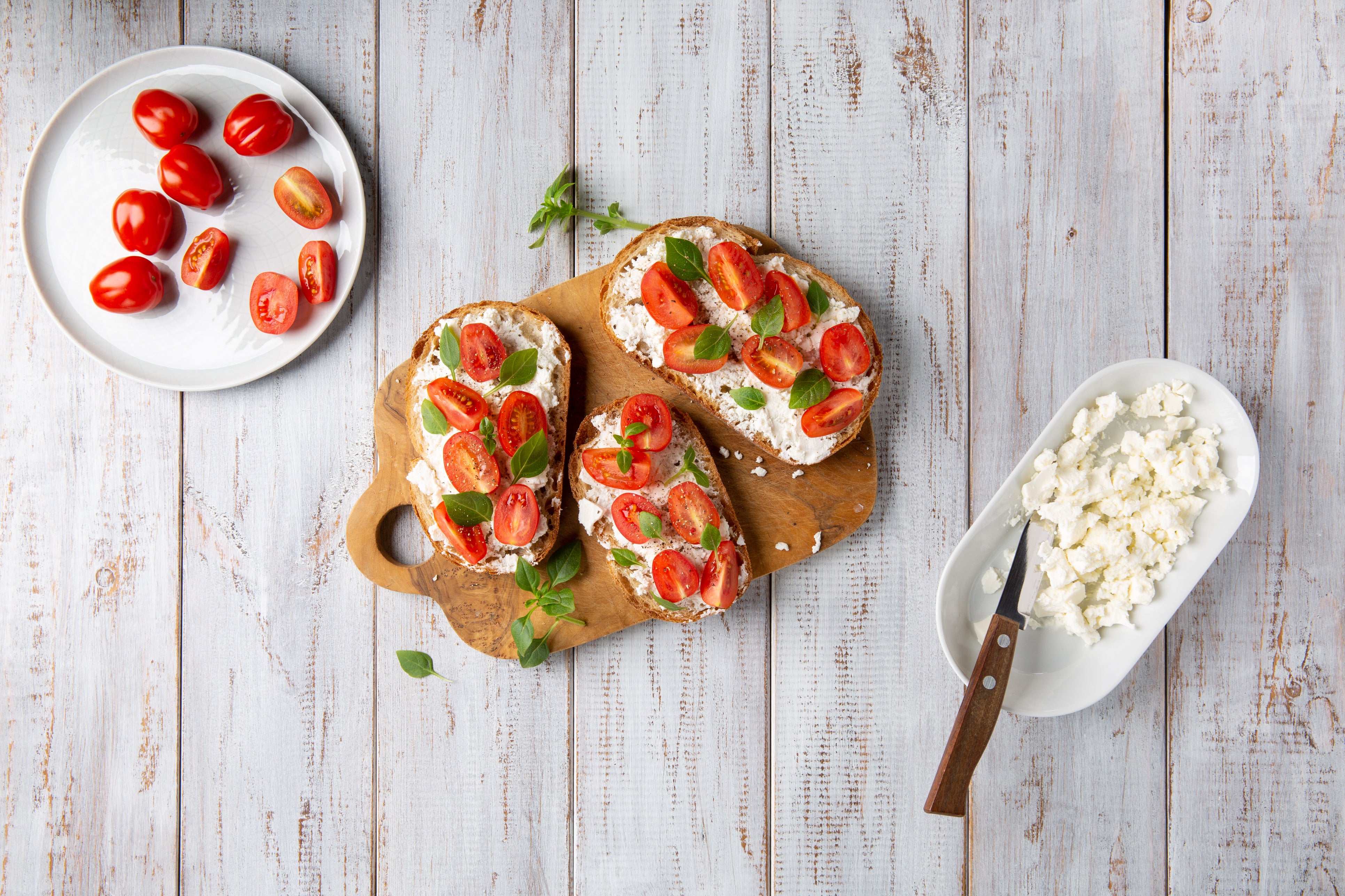 Mini-meals like light cheese spread and tomato on toast can provide essential proteins, healthy fats, vitamins and minerals