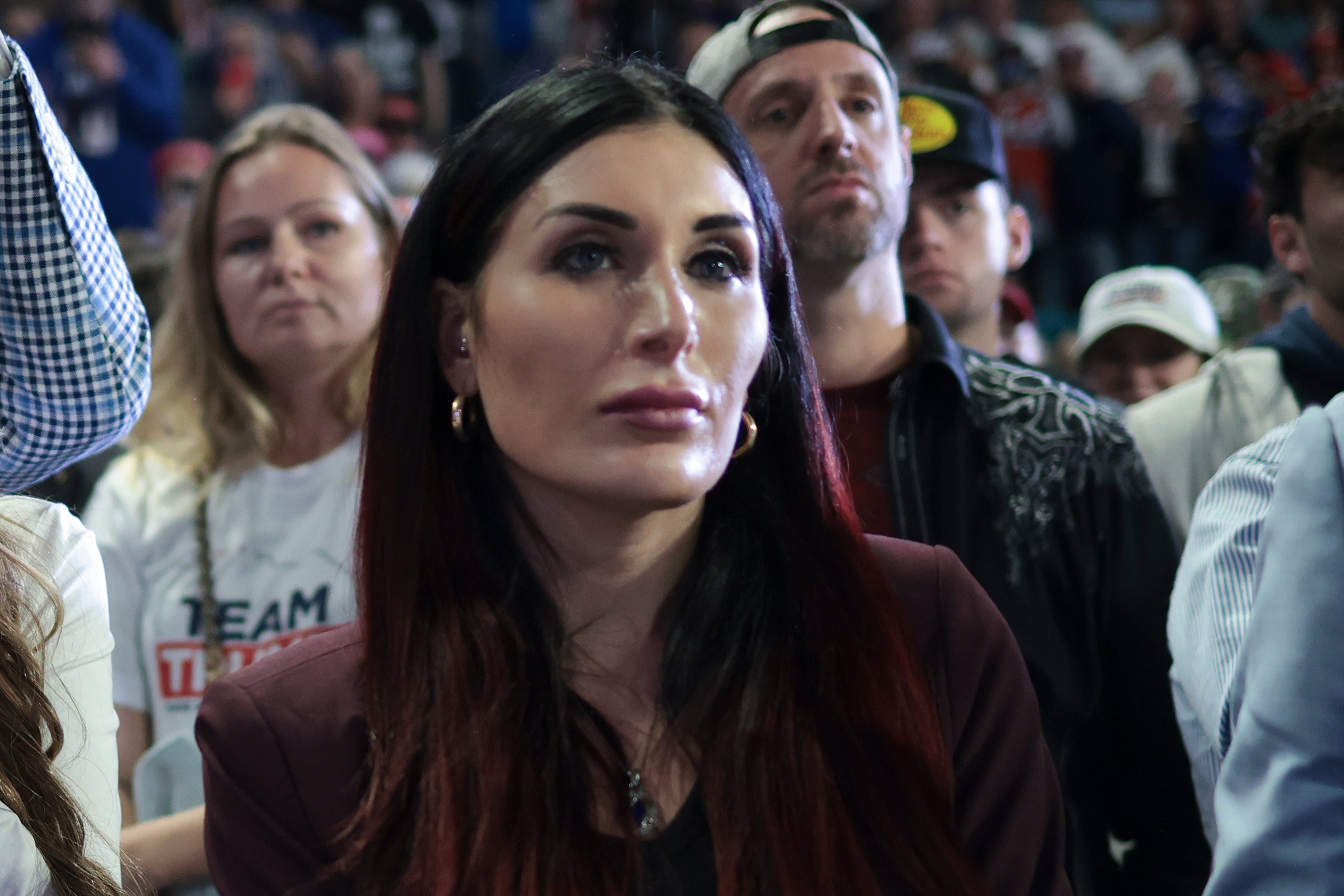 Far-right activist Laura Loomer listens as Republican presidential candidate and former President Donald Trump speaks during a Get Out The Vote rally at Coastal Carolina University on February 10, 2024 in Conway. Some Republicans are concerned about the effect she may be having on the former president