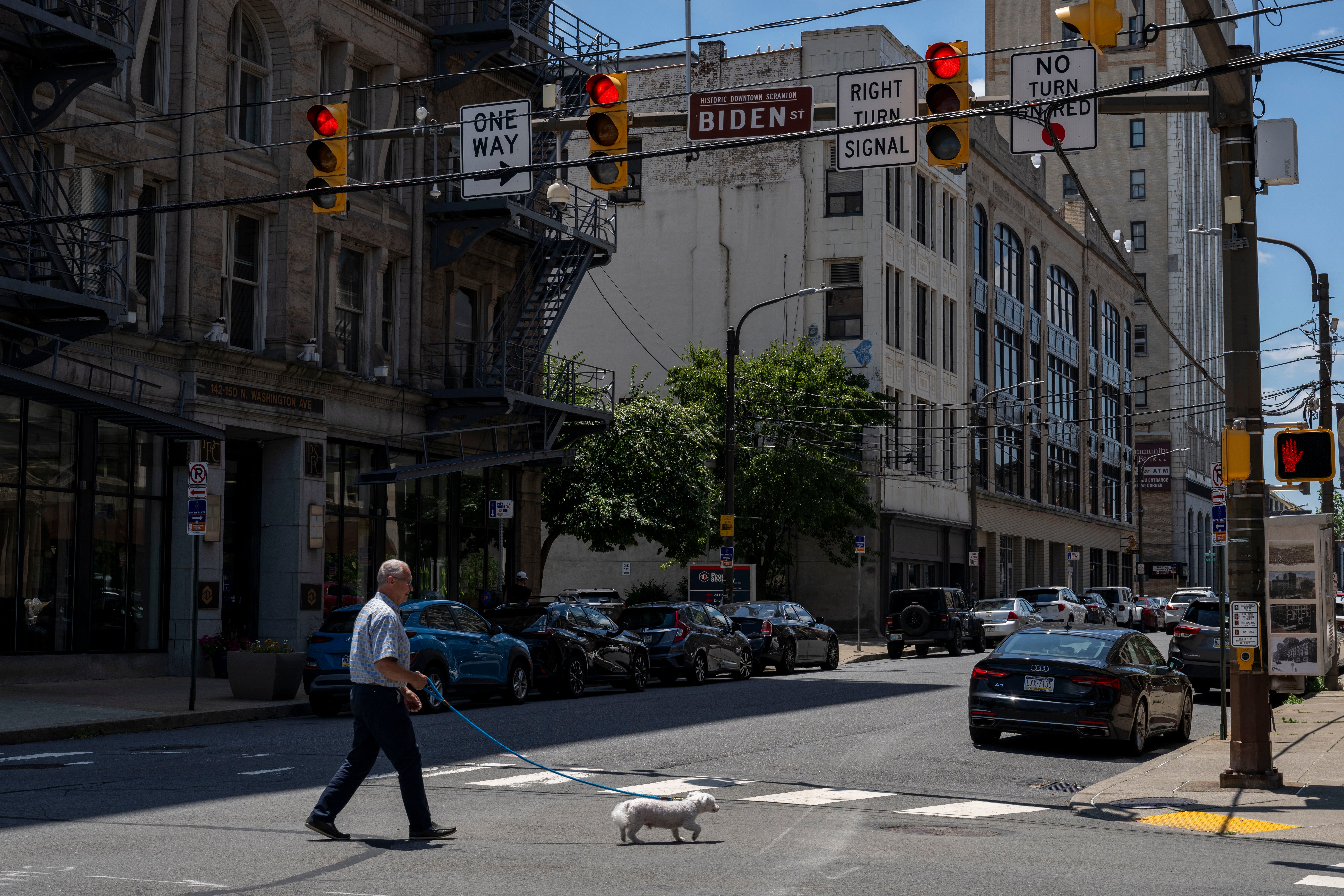 A man walks his dog in downtown Scranton