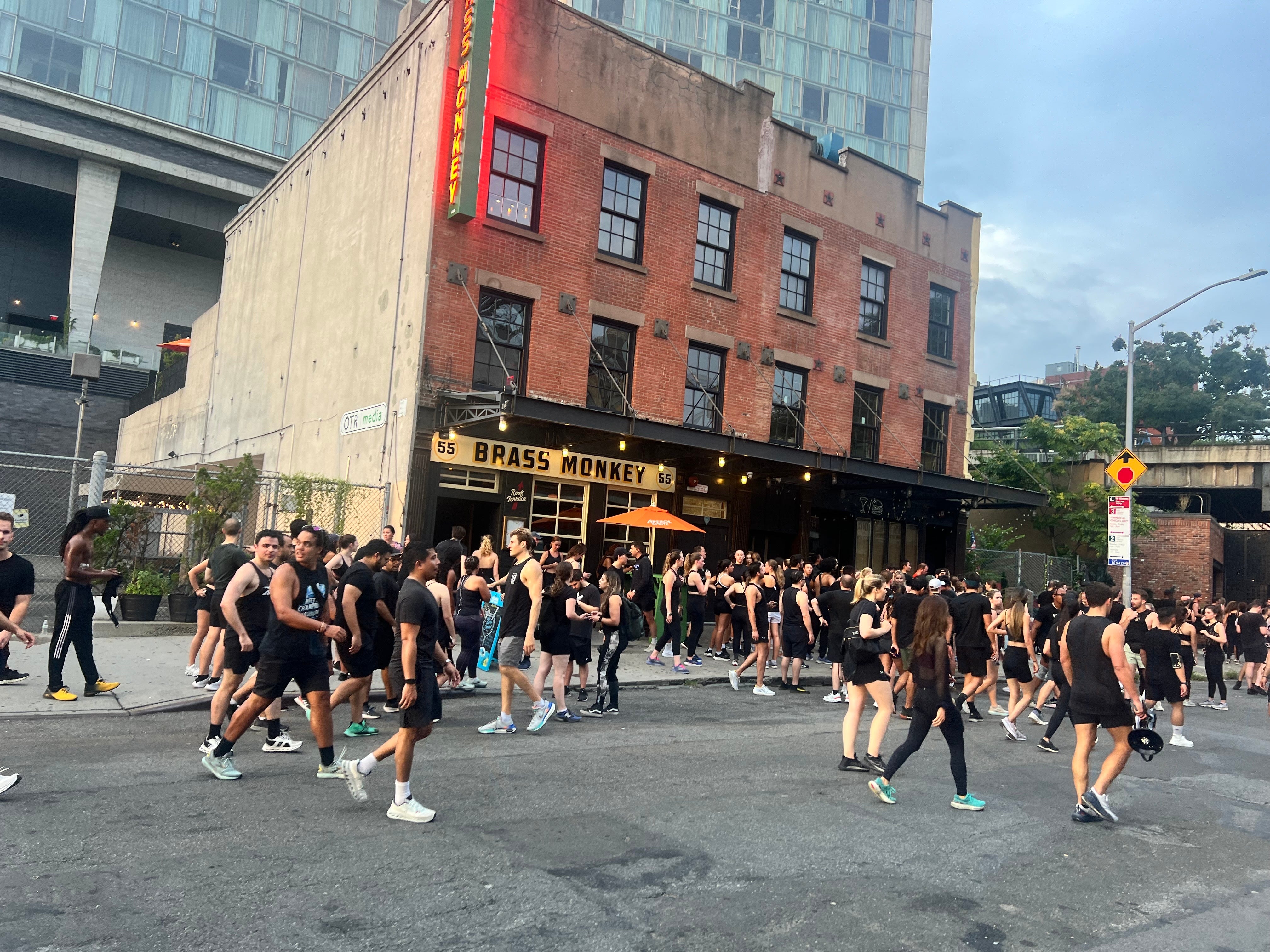 Lunge Run Club runners wait in line to enter the bar after their three-mile run or 1.5-mile walk