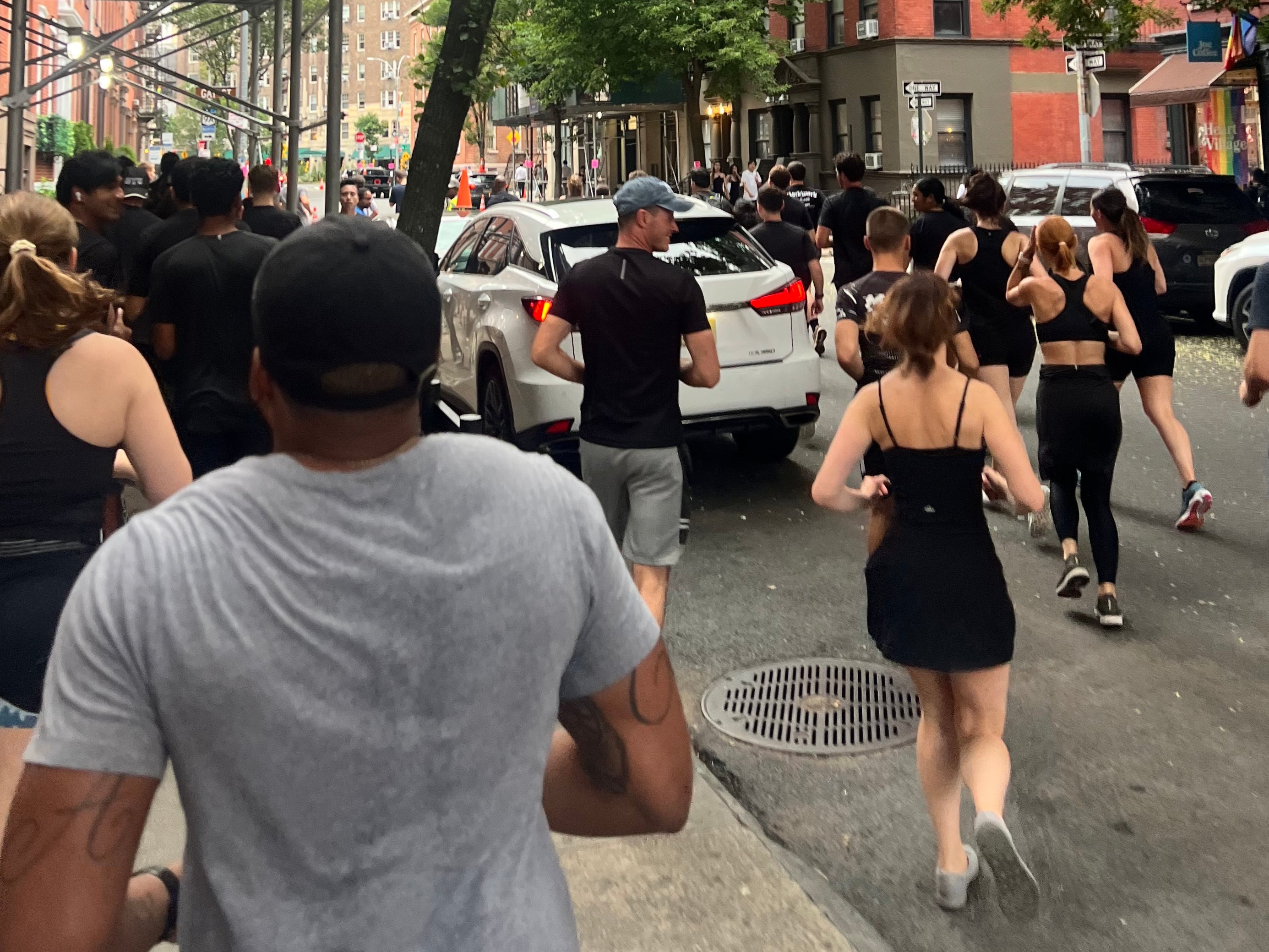 Runners dressed from head to toe in black take to the streets during the Lunge Run Club