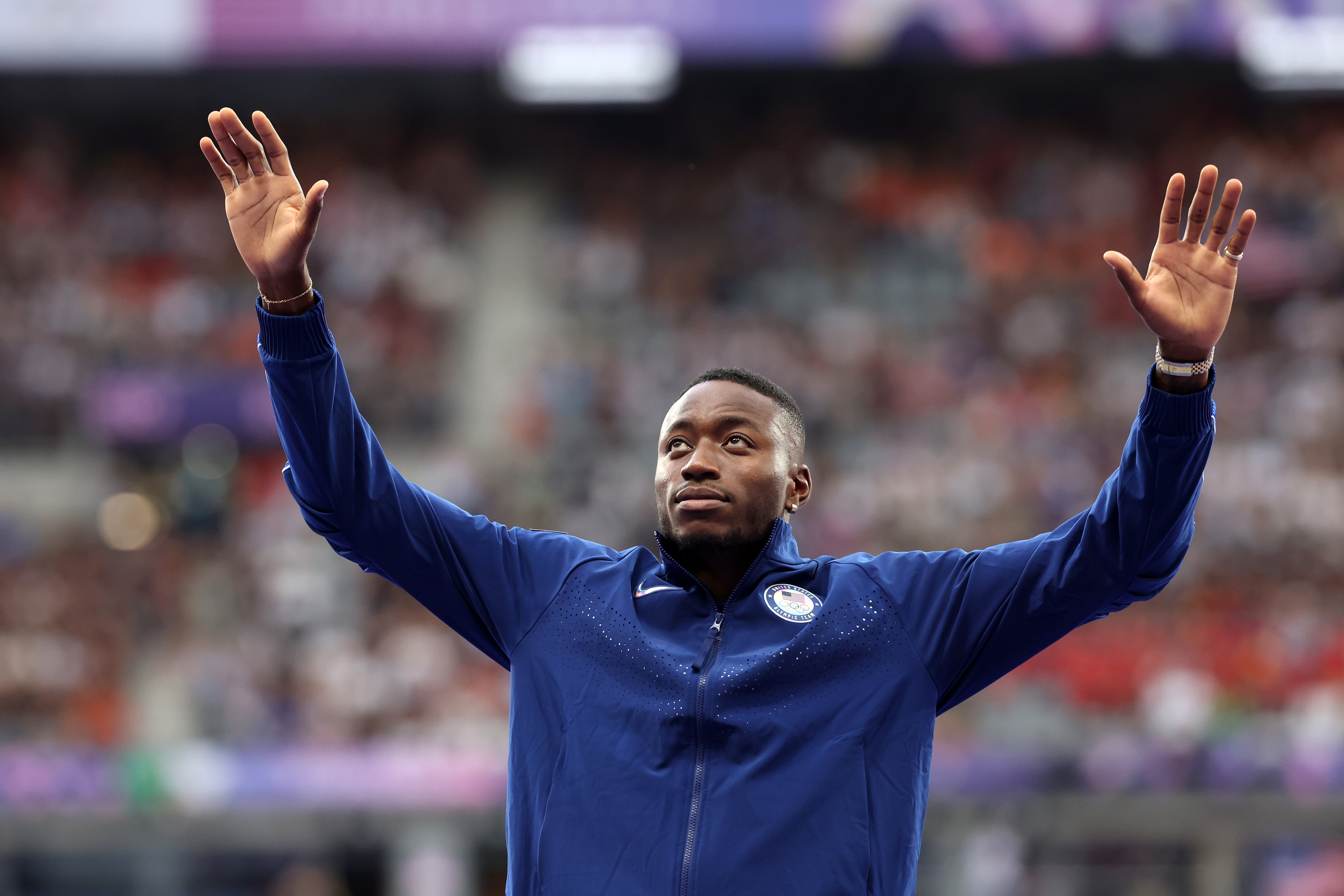 Gold medalist Grant Holloway celebrates at Paris 2024