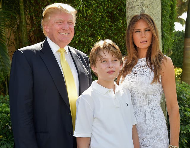 <p>The former first lady says her son, who was 10 at the time, was bullied following the rumor (Melania, Donald and Barron Trump in 2015) </p>