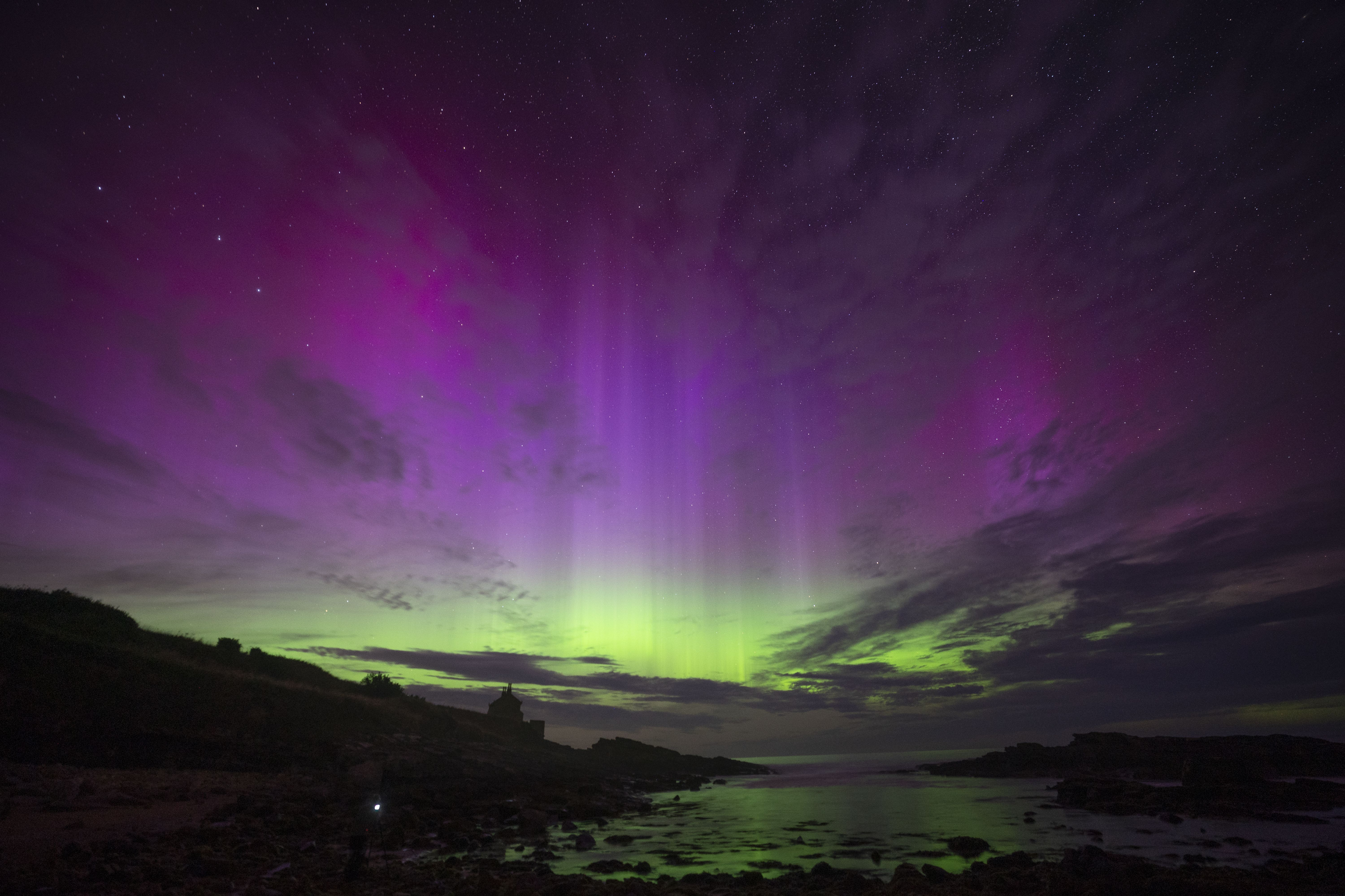 The aurora borealis, also known as the northern lights, fill the sky over The Bathing House in Howick, Northumberland last month (Owen Humphreys/PA)