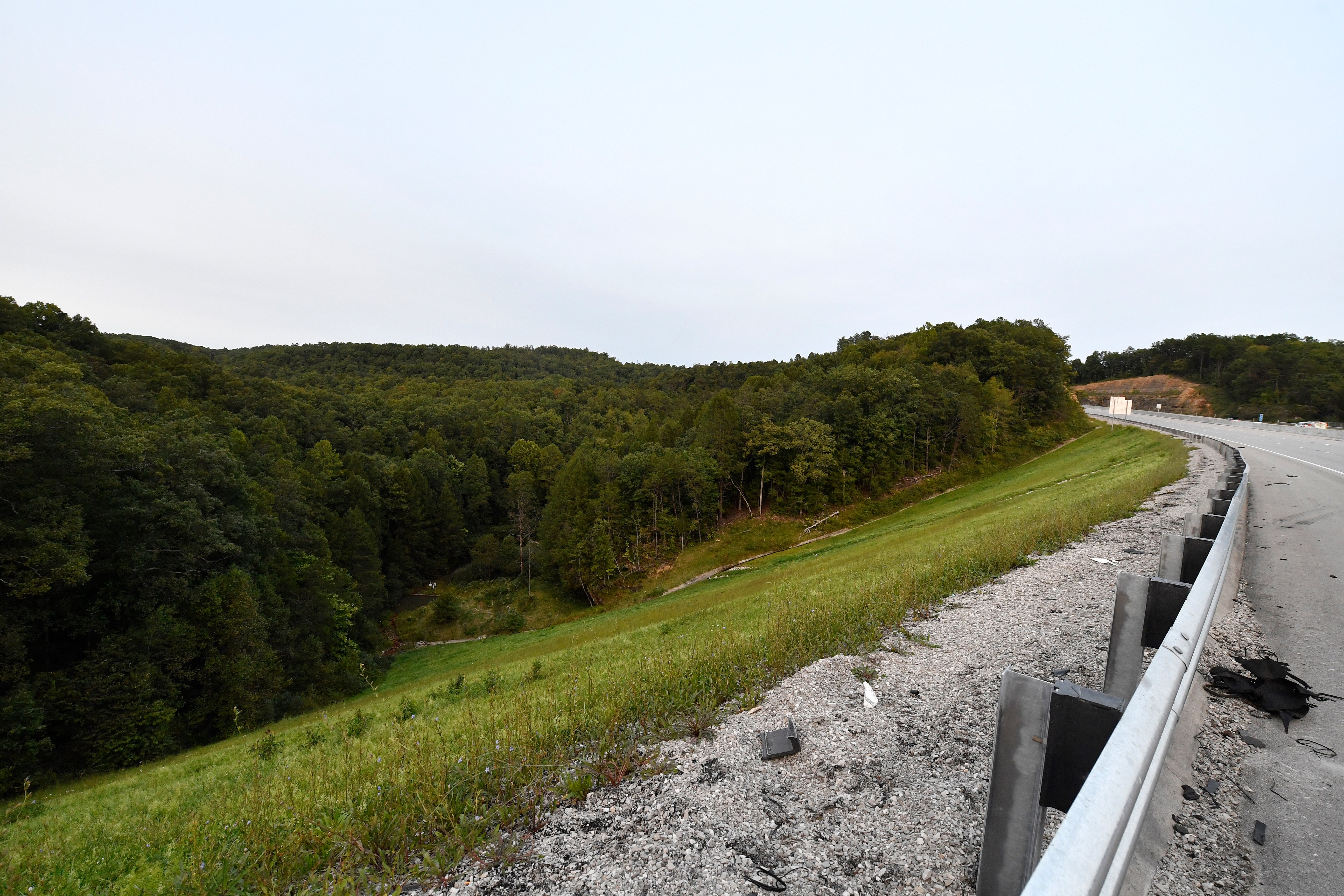 Wooded areas alongside Interstate 75 near Livingston, Kentucky, where law enforcement searched for days for the shooter