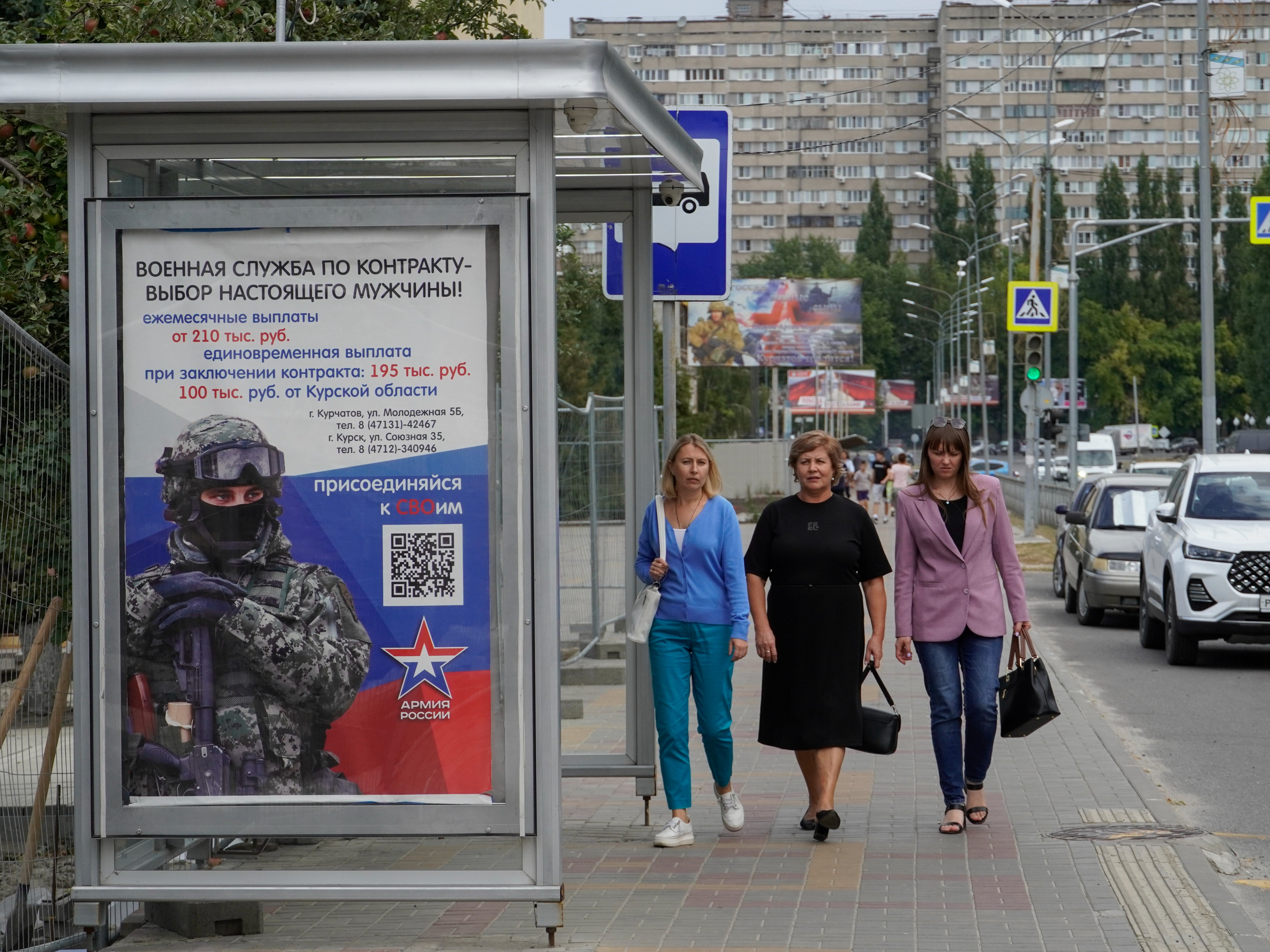 A poster reads ‘Military service under contract is the choice of real men’, in Kursk