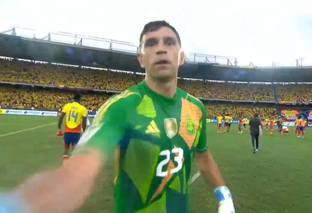 <p>Emi Martinez hit the camera after being approached at full time</p>