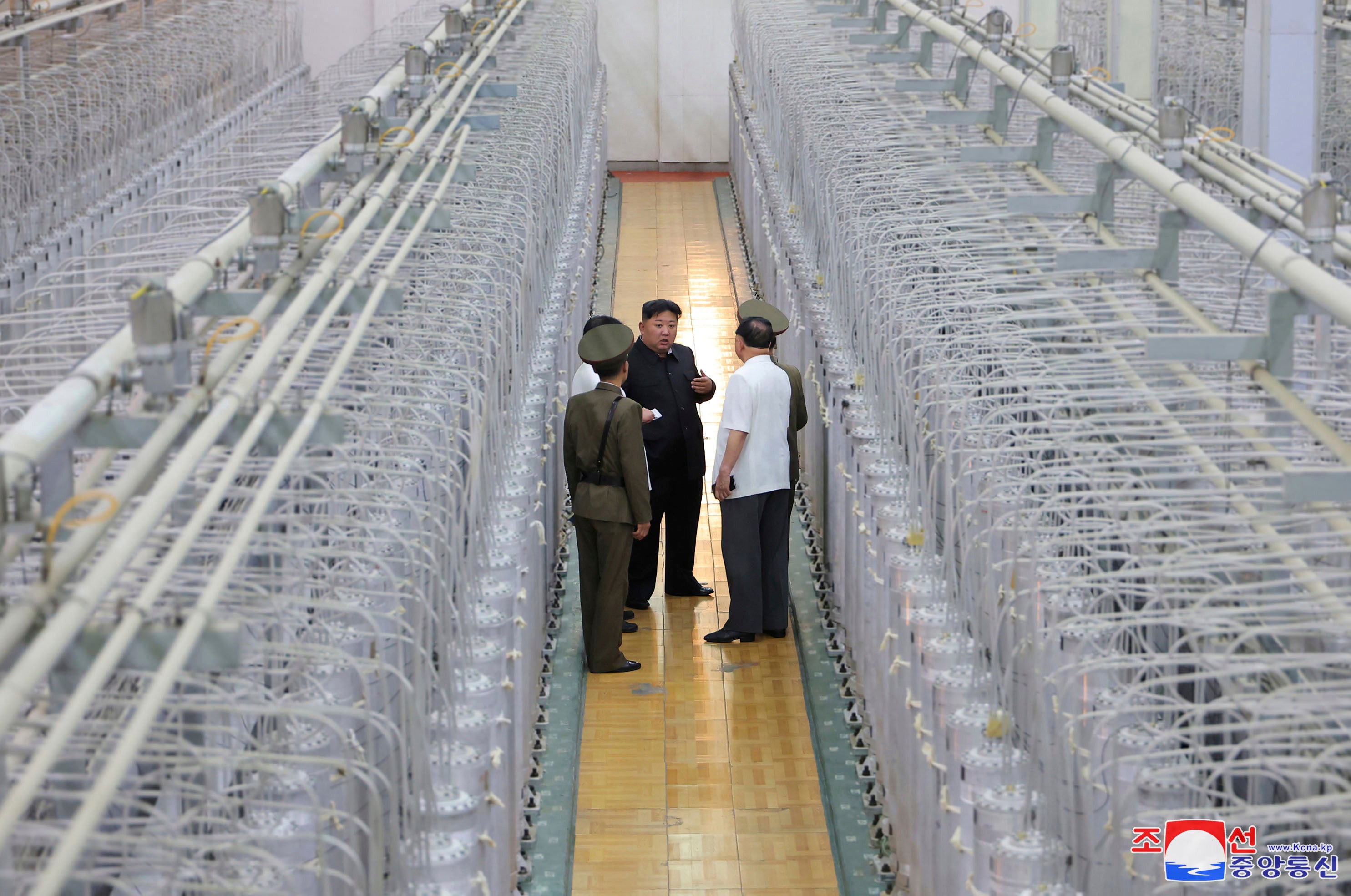 Kim Jong-un tours a uranium enrichment facility at an undisclosed location in North Korea in this photo released by KCNS on 13 September 2024