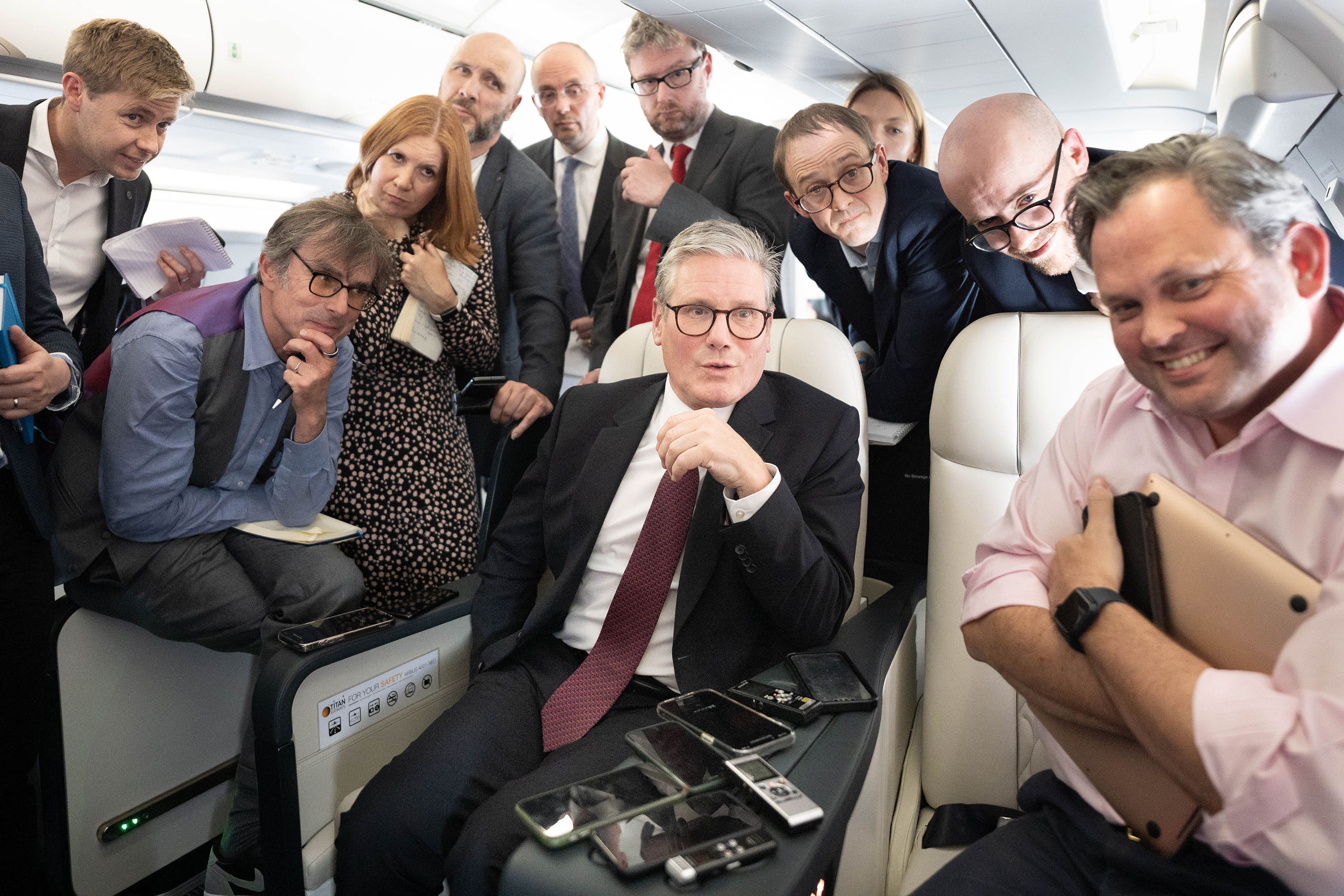 Prime Minister Sir Keir Starmer talks to the media on board his plane as he flies to Washington DC (Stefan Rousseau/PA)