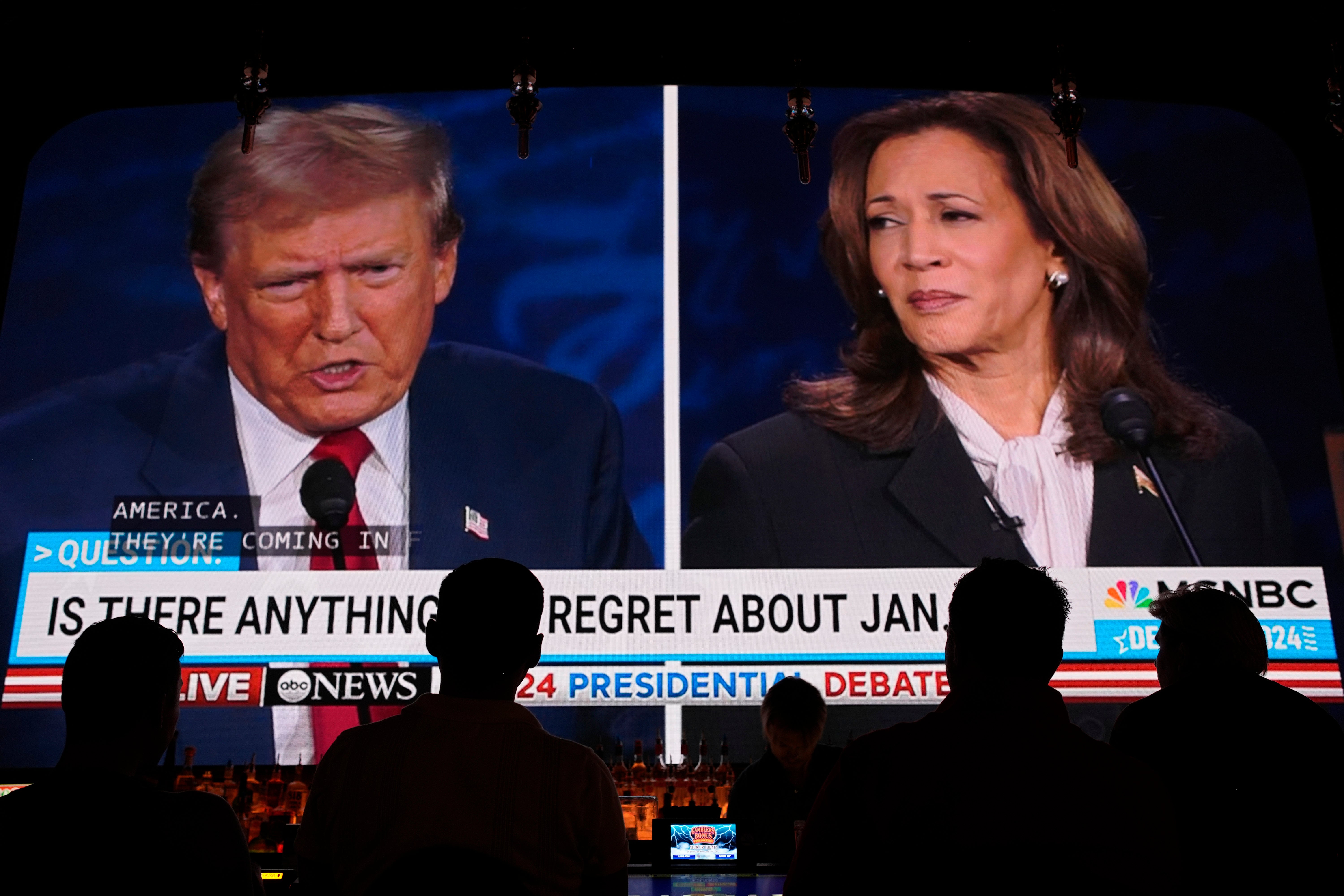 People watch the presidential debate between Republican presidential nominee former President Donald Trump and Democratic nominee Vice president Kamala Harris