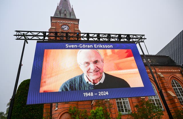 <p>An image of Sven-Goran Eriksson displayed on a screen outside his funeral at the Fryksande Church</p>