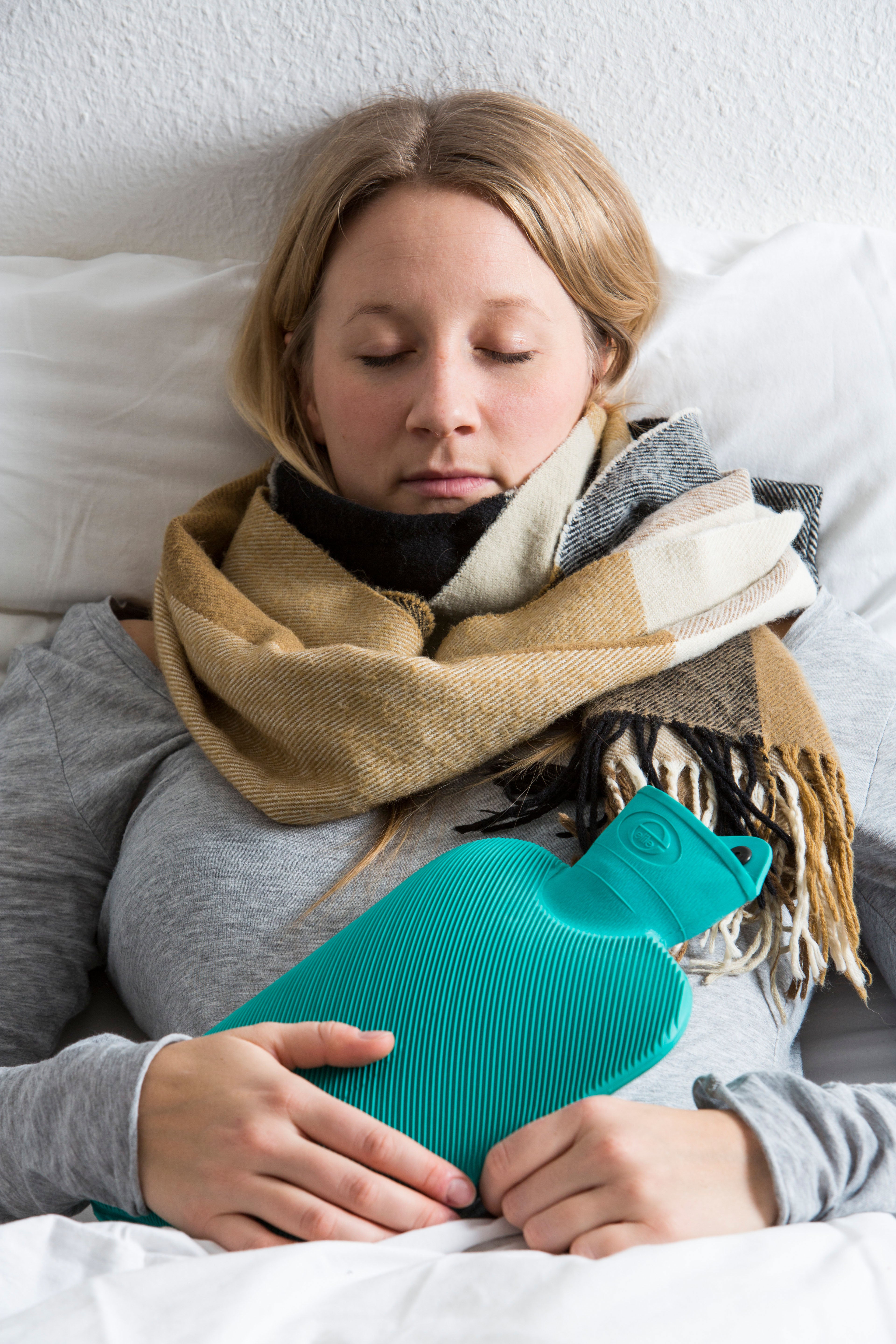 Keep yourself warm with layers and a hot water bottle (Alamy/PA)