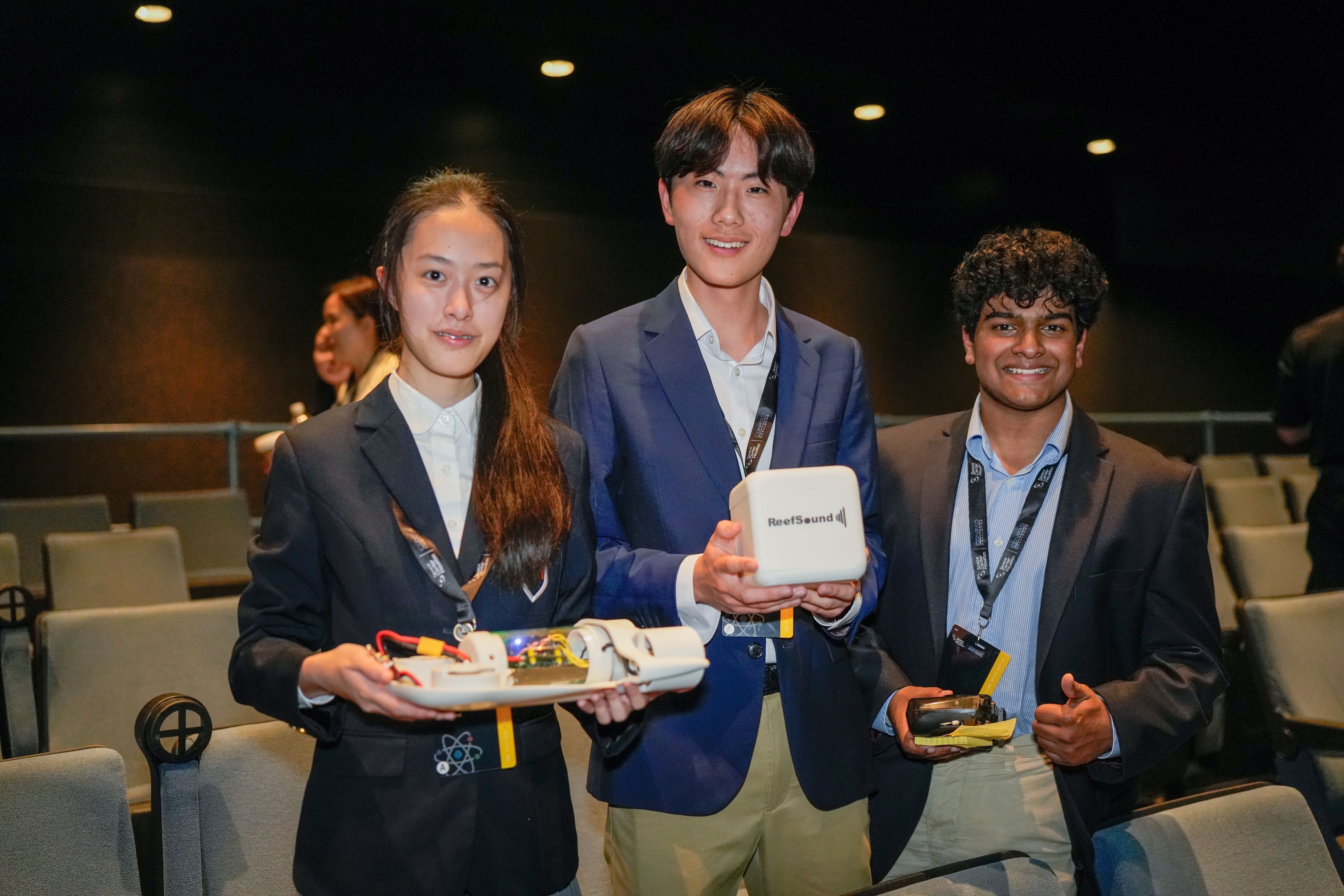 Bonnie Liu, Thenuk Rodrigo and Simba Shi at the Conrad Challenge at Space Center Houston