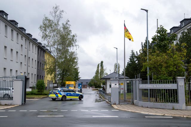 <p>A police car drives on the grounds of  the Upper Franconia barracks, in Hof, Germany.</p>