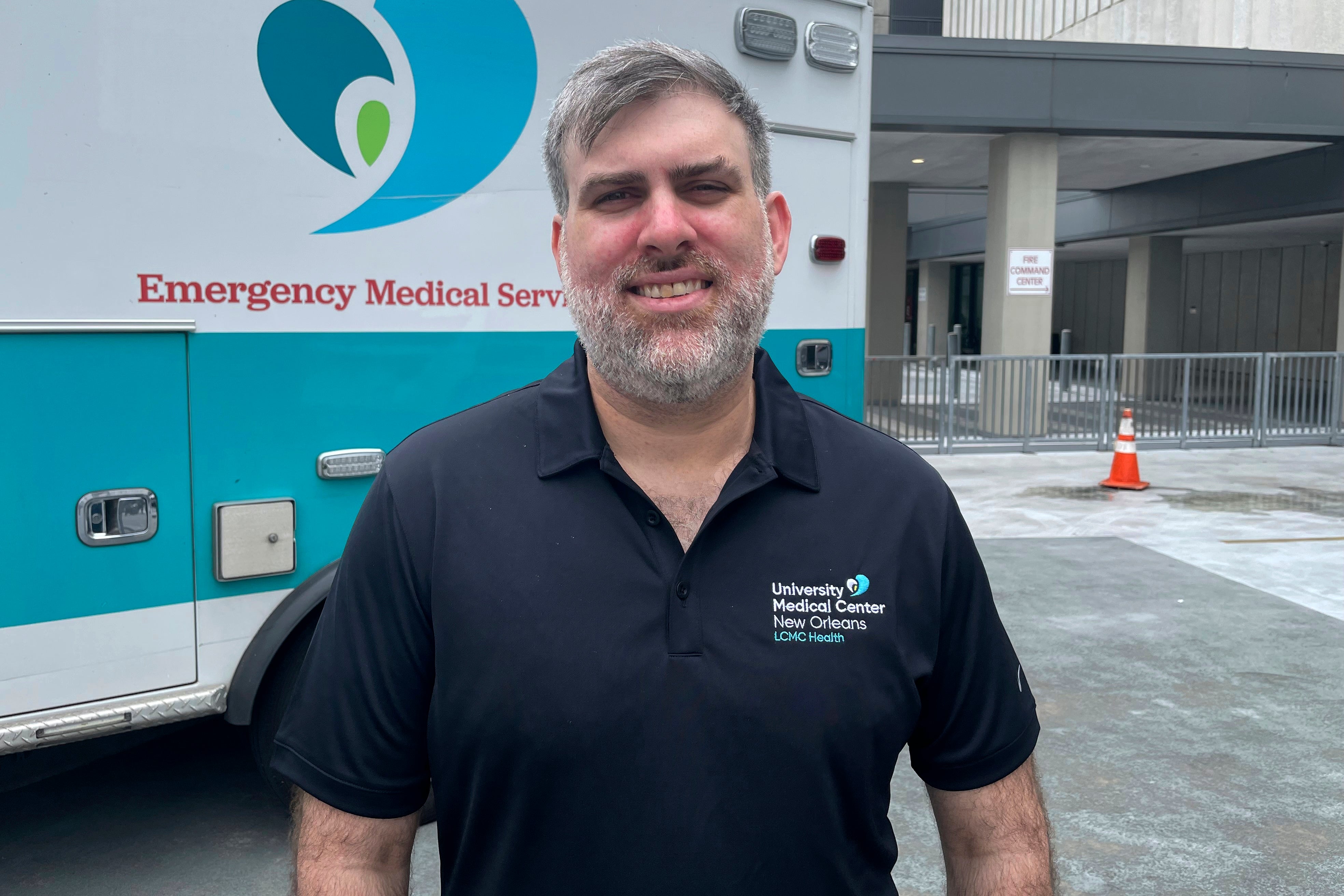 Emergency Room nurse Miles Crawford stands outside University Medical Center in New Orleans on Thursday. Crawford hurt himself freeing a man whose car was slowly submerging under floodwaters from Hurricane Francine on Wedneday