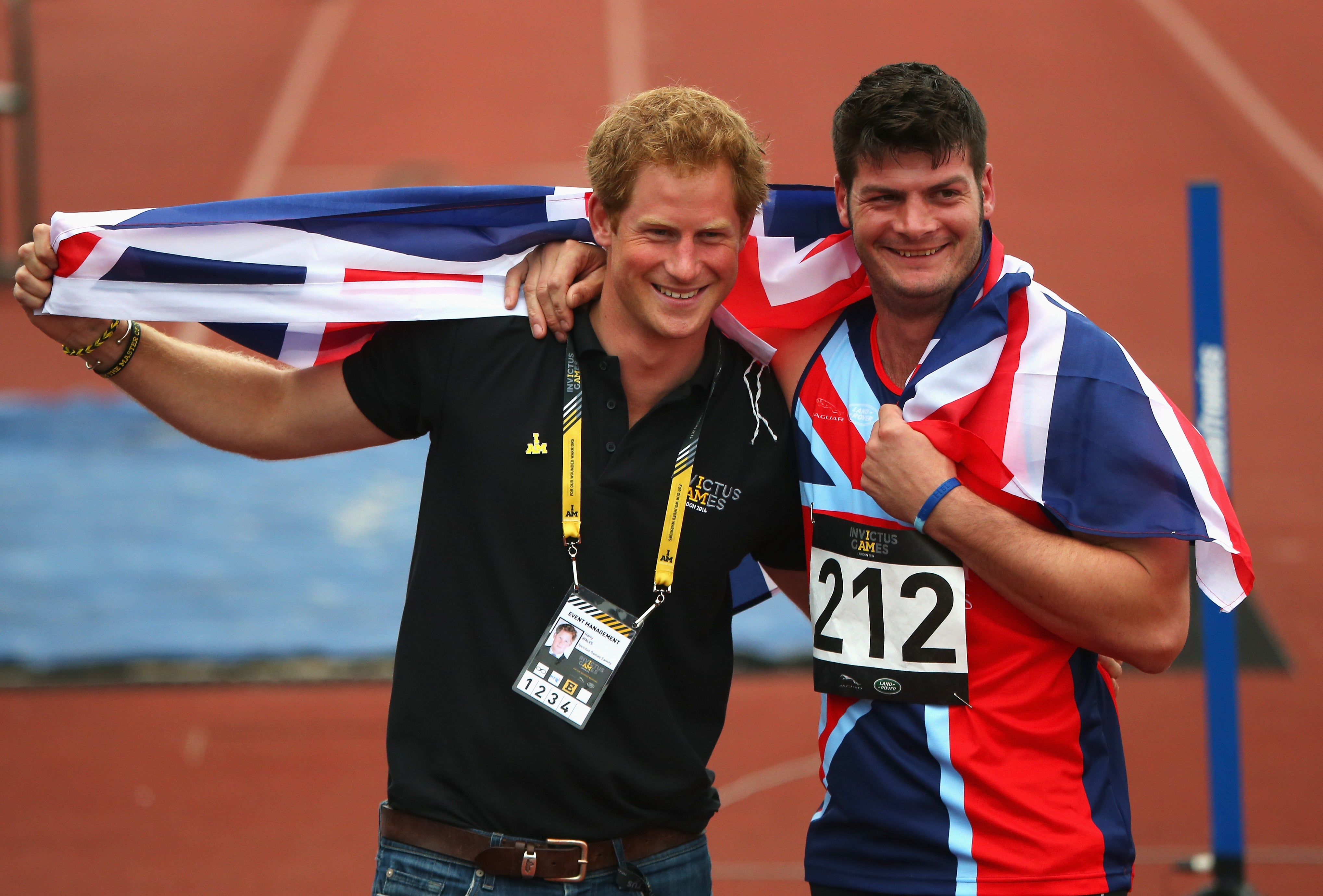 Harry celebrates with David Henson, who won a gold medal at the Invictus Games, which he founded, in 2014 (Photo by Paul Thomas/Getty Images for Jaguar