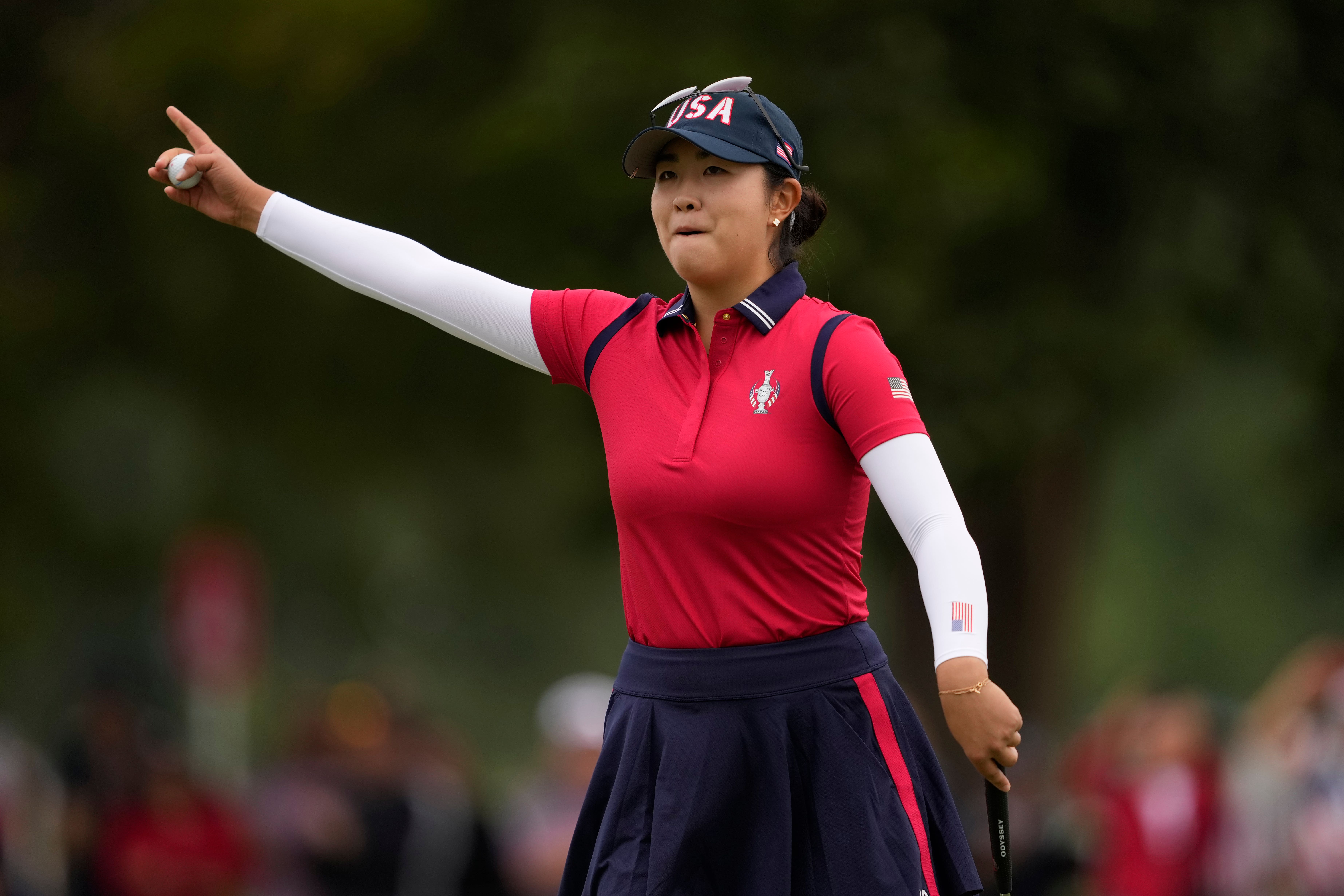 American Rose Zhang celebrates after winning a foursomes match on the 16th hole during day one of the Solheim Cup (Matt York/AP)