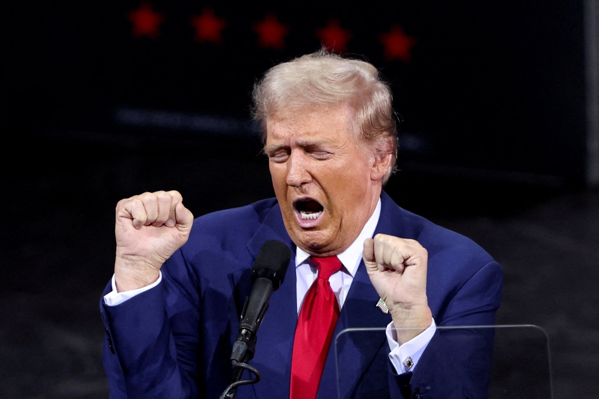 Trump gestures while speaking during the campaign event where six attendees said they later had to seek medical attention