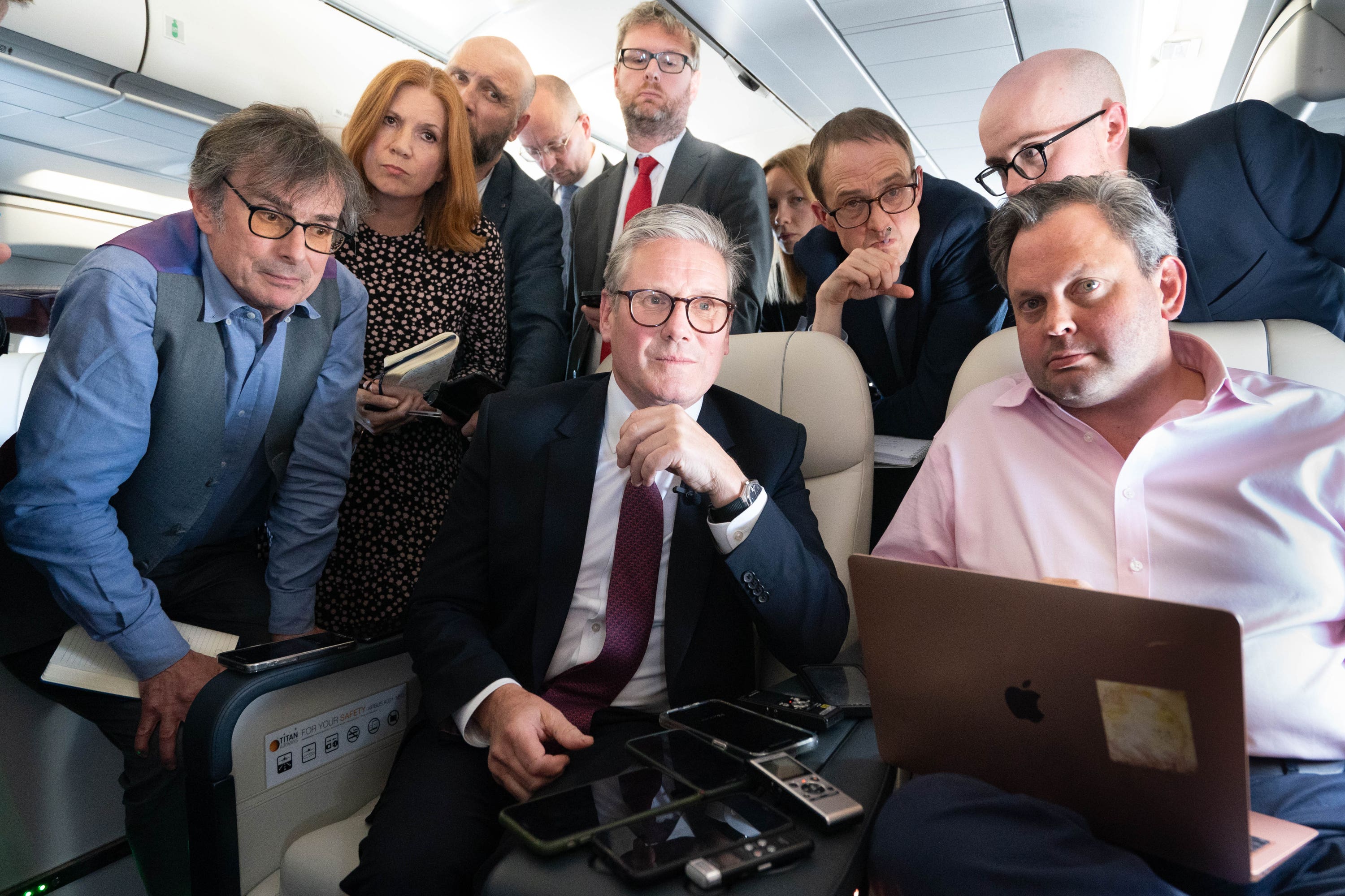 Sir Keir Starmer talks to the media on board his plane as he flies to Washington DC (Stefan Rousseau/PA)