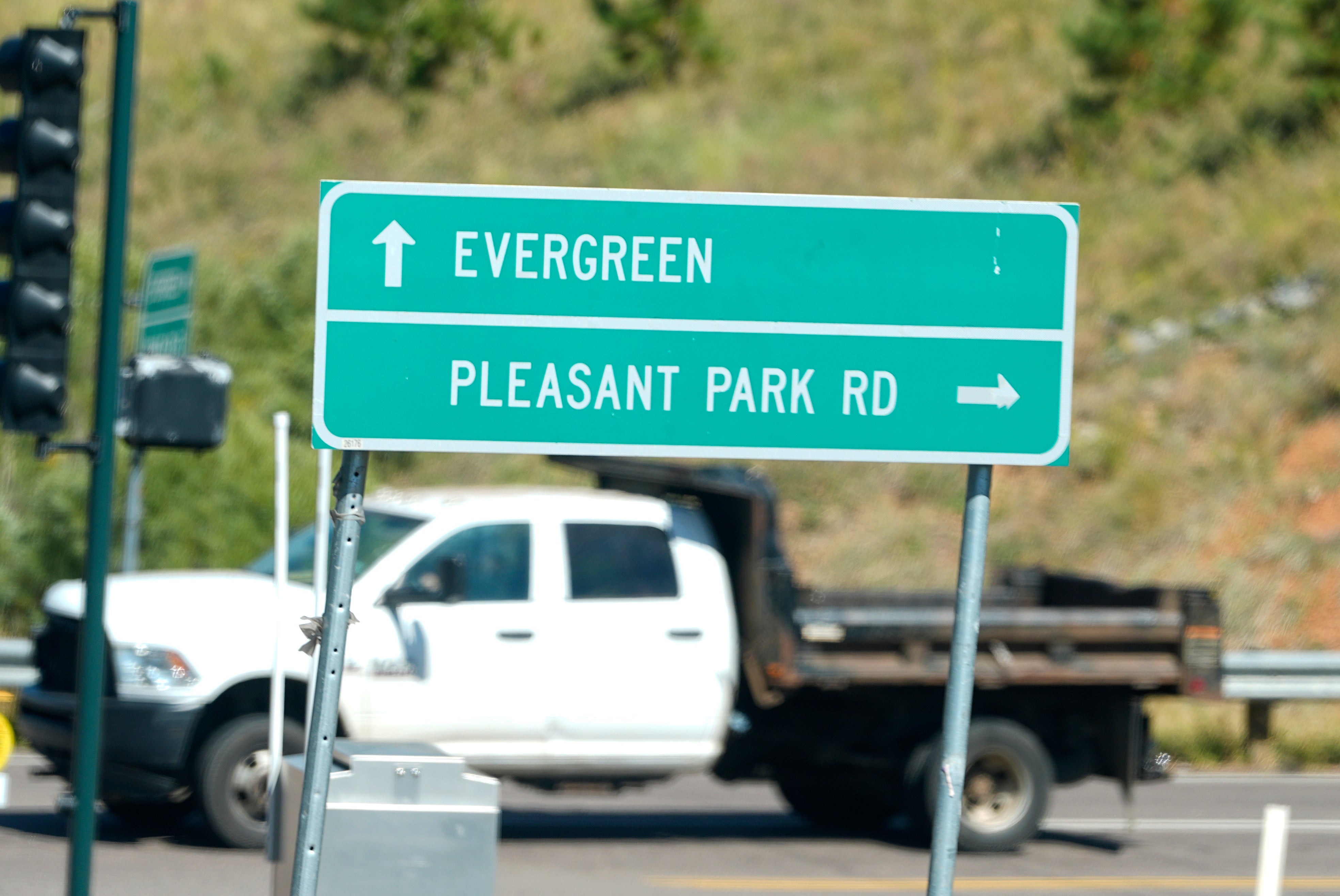 A sign off Highway 285 points motorists to Pleasant Park Road where a teenager, who was scouting for a location