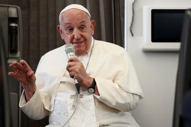 <p>Pope Francis speaks during a news conference aboard the papal plane on Friday, on the flight back after his 12-day journey across southeast Asia and Oceania</p>