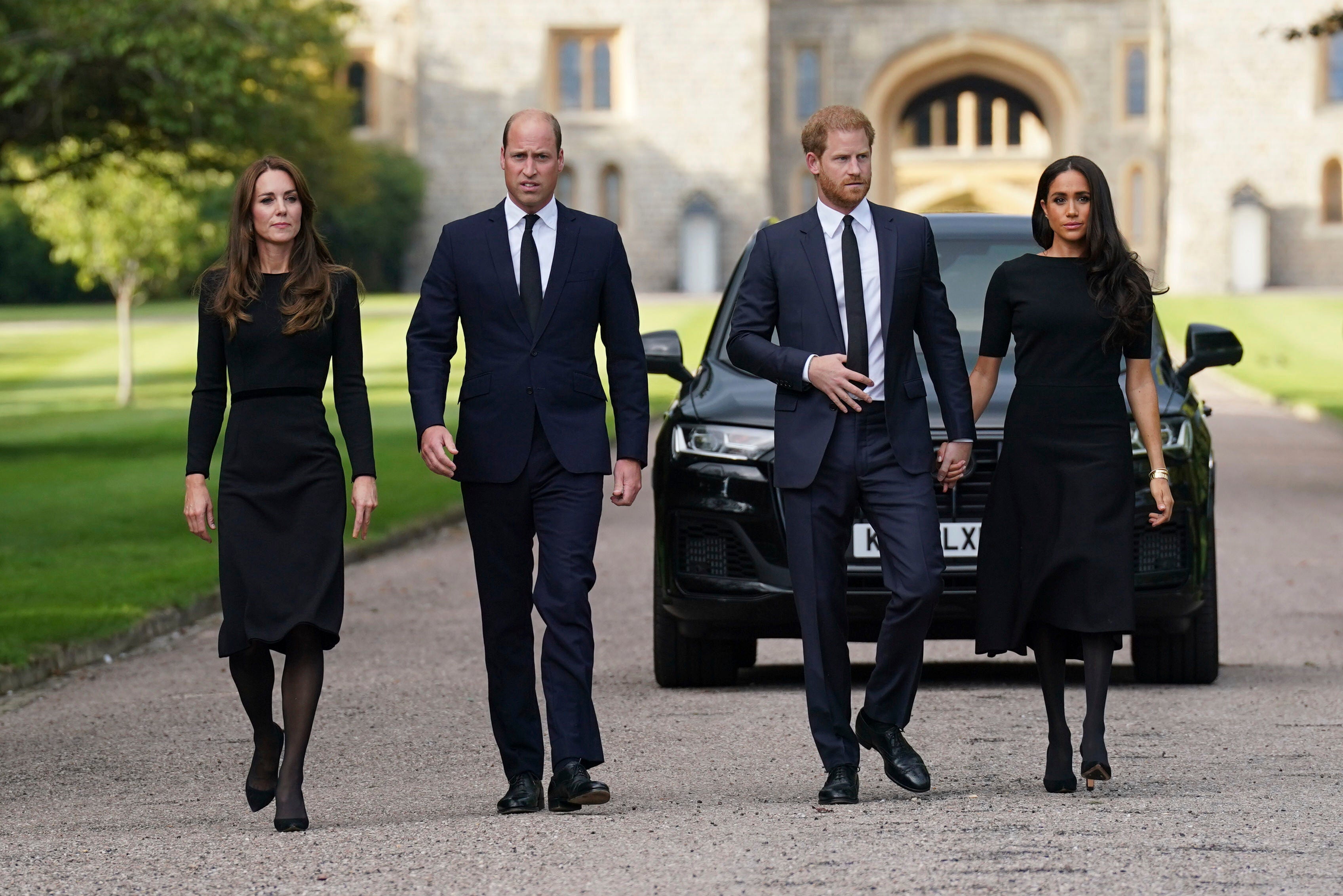 From left, Princess Kate, Prince William, Prince Harry and Meghan, Duchess of Sussex, walk at Windsor Castle following the death of Queen Elizabeth II in September 2022