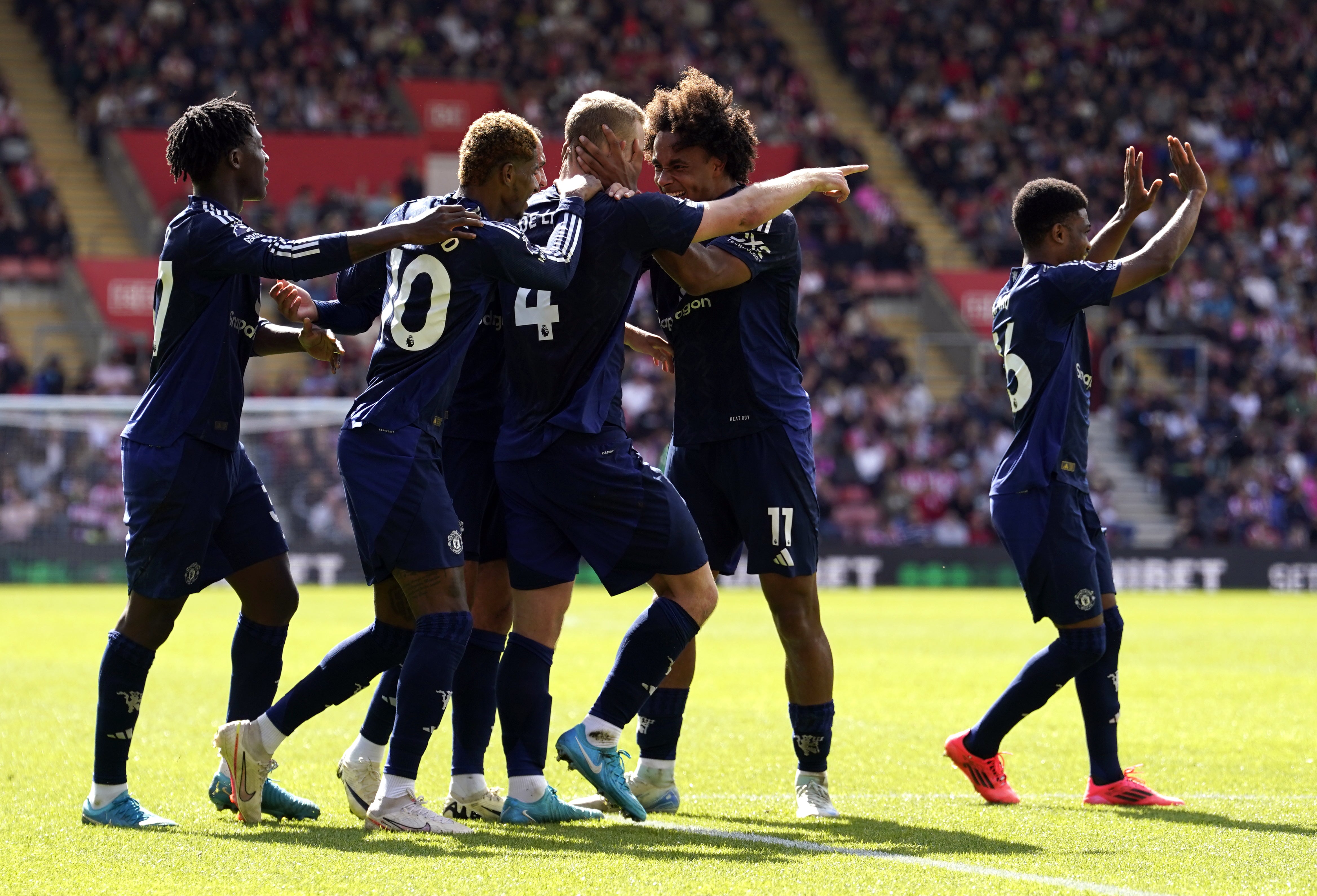 Manchester United players surround Matthijs de Ligt after he scored the opening goal against Southampton