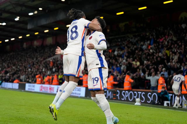 Christopher Nkunku celebrates with Chelsea team-mate Jadon Sancho at Bournemouth (Alastair Grant/AP)