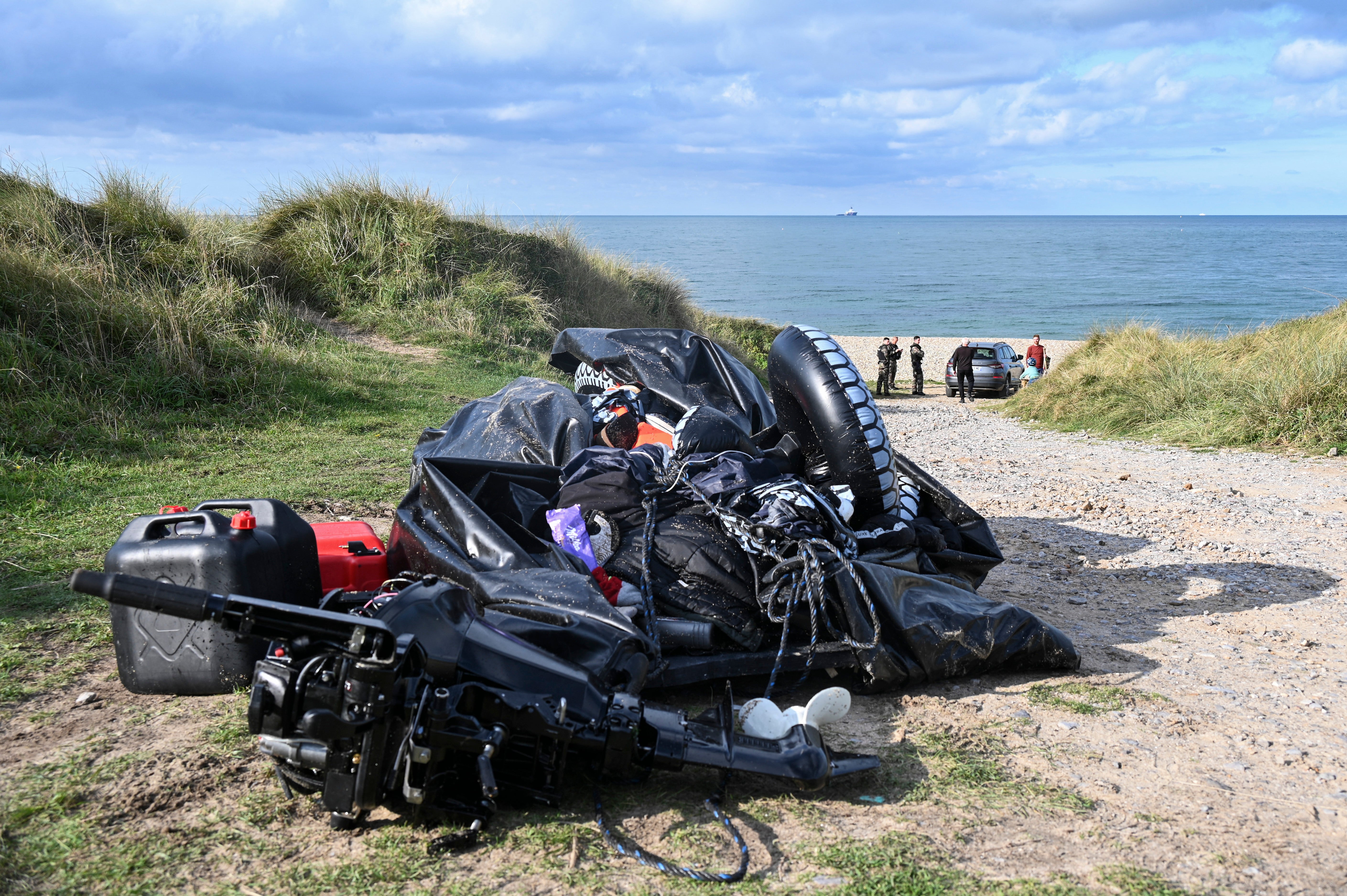 A damaged migrants’ boat, thought to be the vessel that hit trouble while crossing the English Channel, leading to the death of eight people