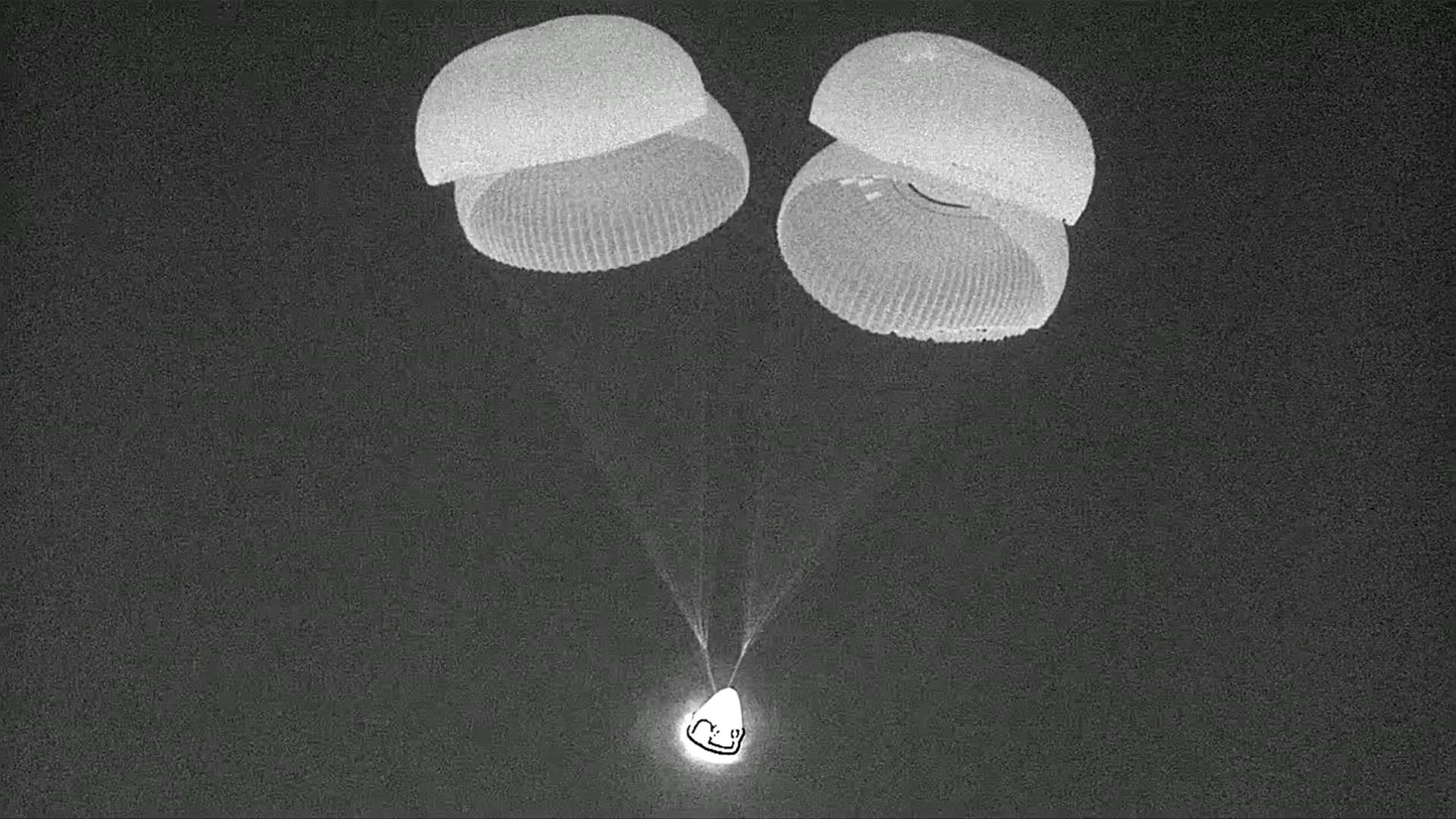 The space capsule landing in the Gulf of Mexico