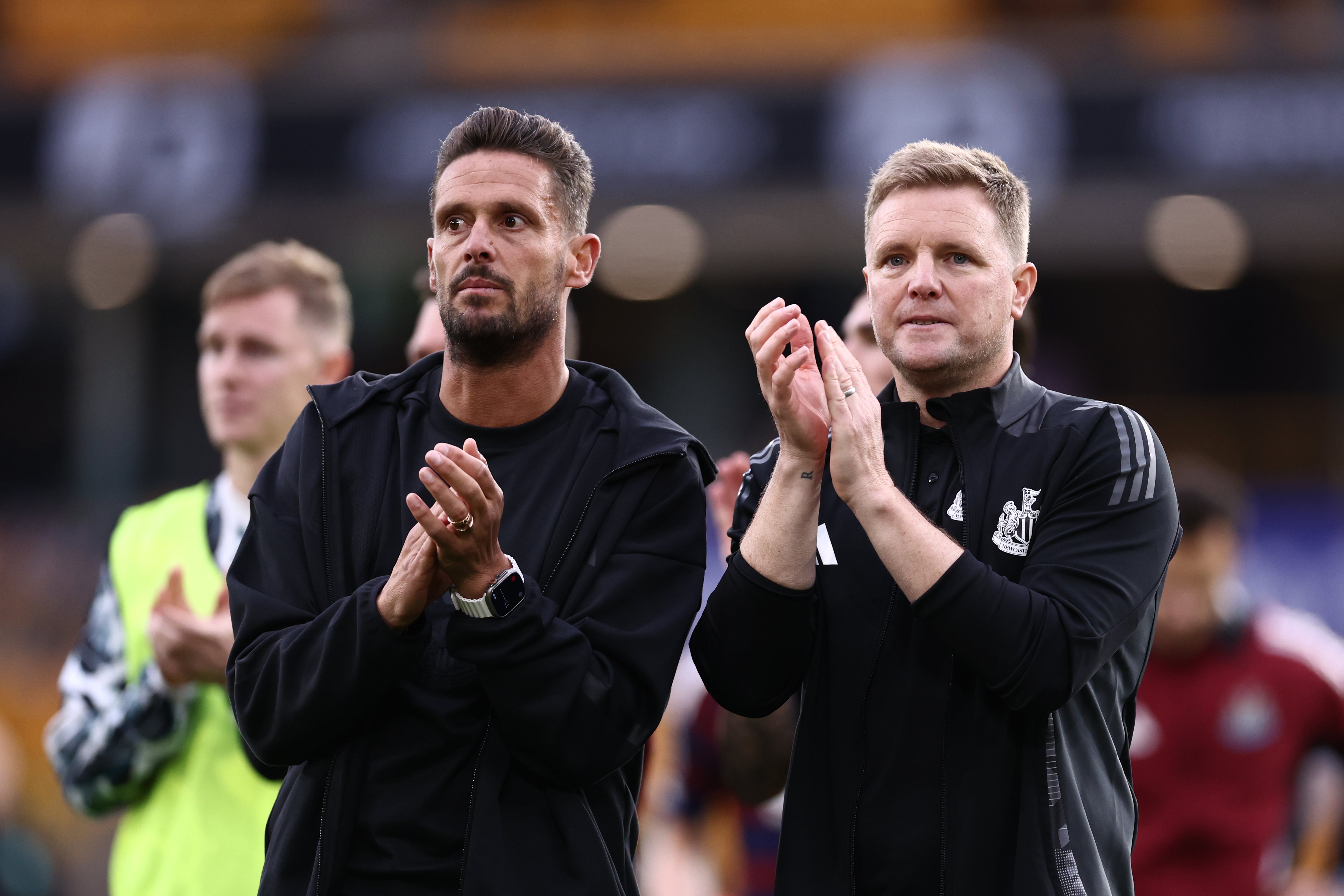 Eddie Howe, right, and assistant Jason Tindall applaud the Newcastle fans