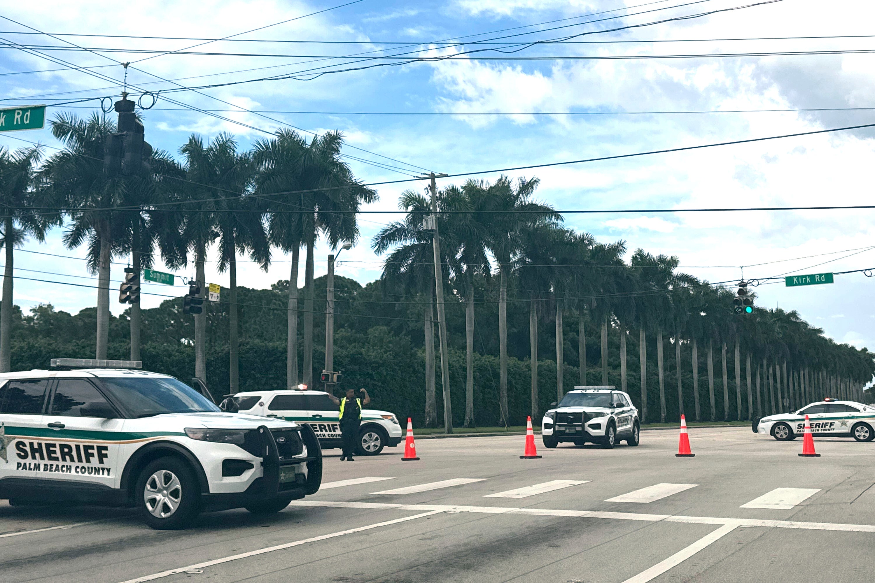 Sheriff vehicles are pictured near Trump International Golf Club on Sunday 15 September 2024 in West Palm Beach, Florida, after gunshots were reported