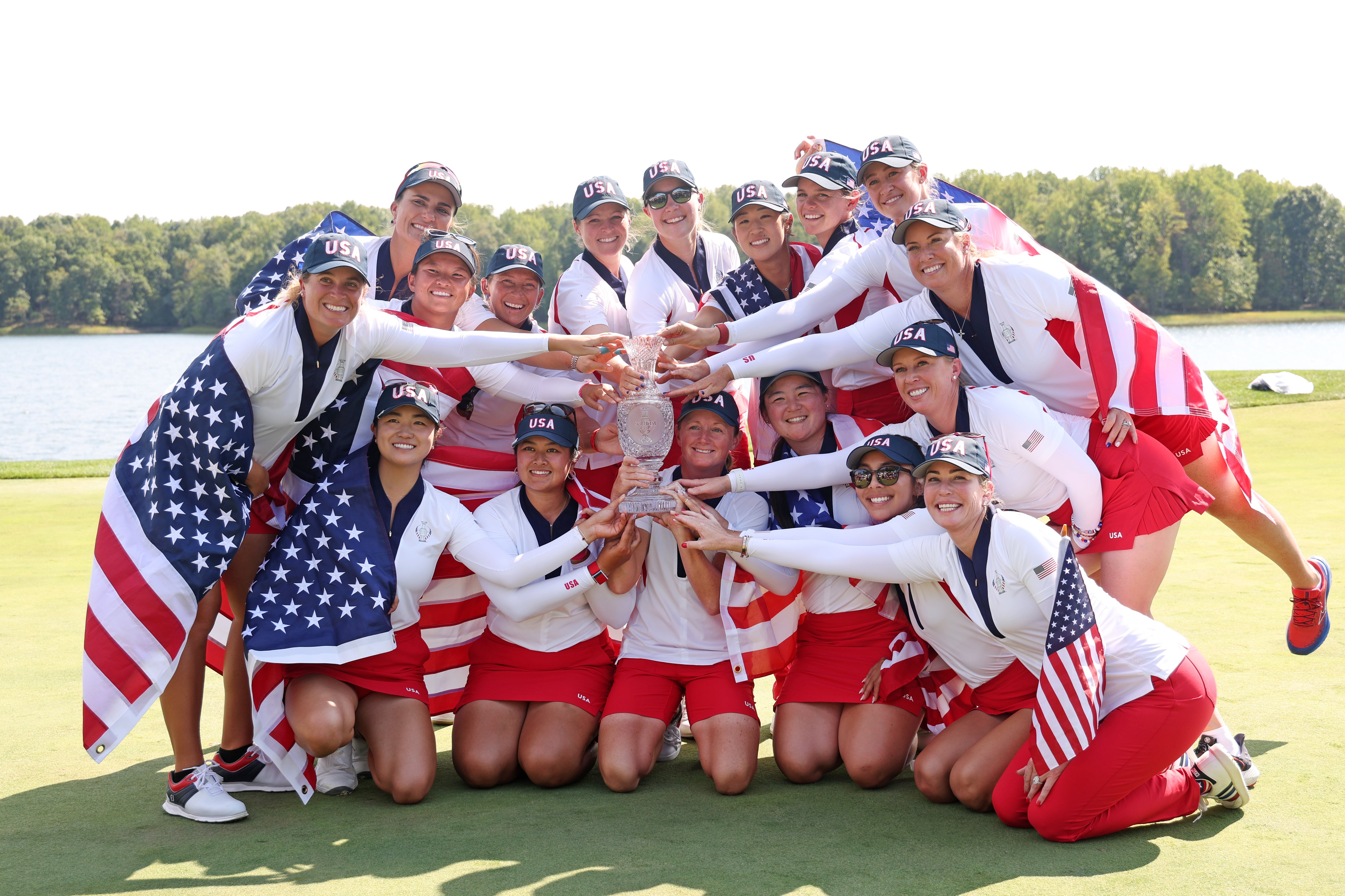 Team USA celebrate with the Solheim Cup