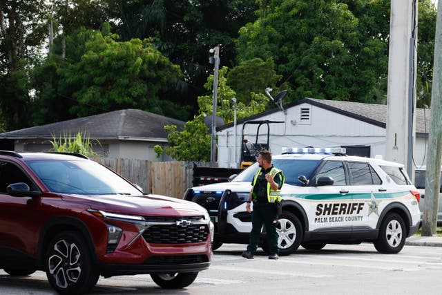 <p>A police officer directs traffic near Trump International Golf Club after the apparent assassination attempt of Republican presidential nominee former President Donald Trump in West Palm Beach, Fla., Sunday, Sept. 15, 2024</p>