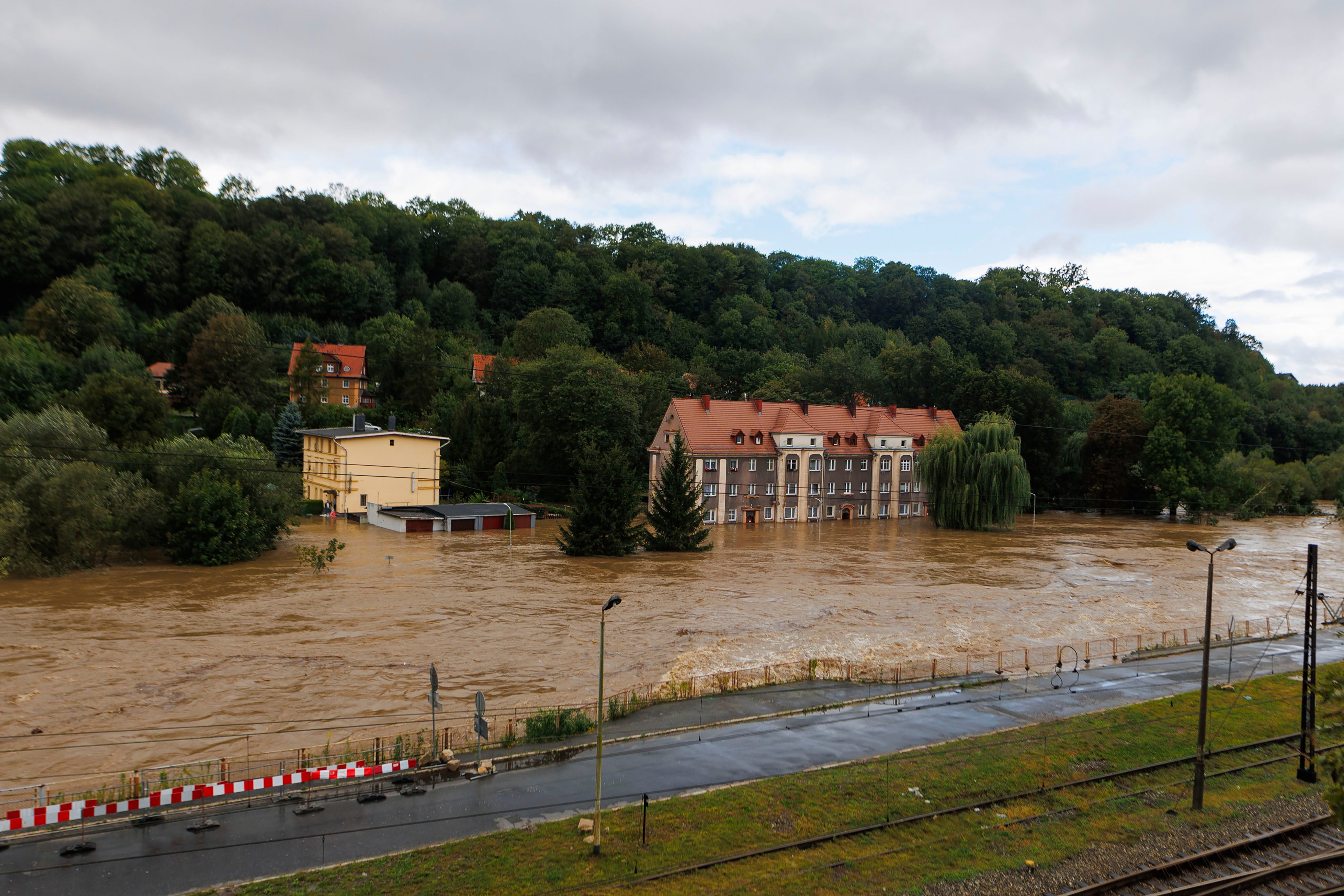 Garages and a house flooded in the town Kłodzko, in Poland's southwest, Sunday, 15 Sept 2024, after days of unusually heavy rain