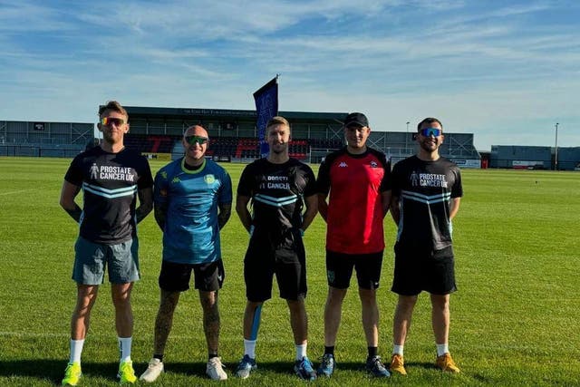 Tom Vosper (far right) with his friends as they run 10km through all 55 English cities for Prostate Cancer UK (Tom Vosper/PA)