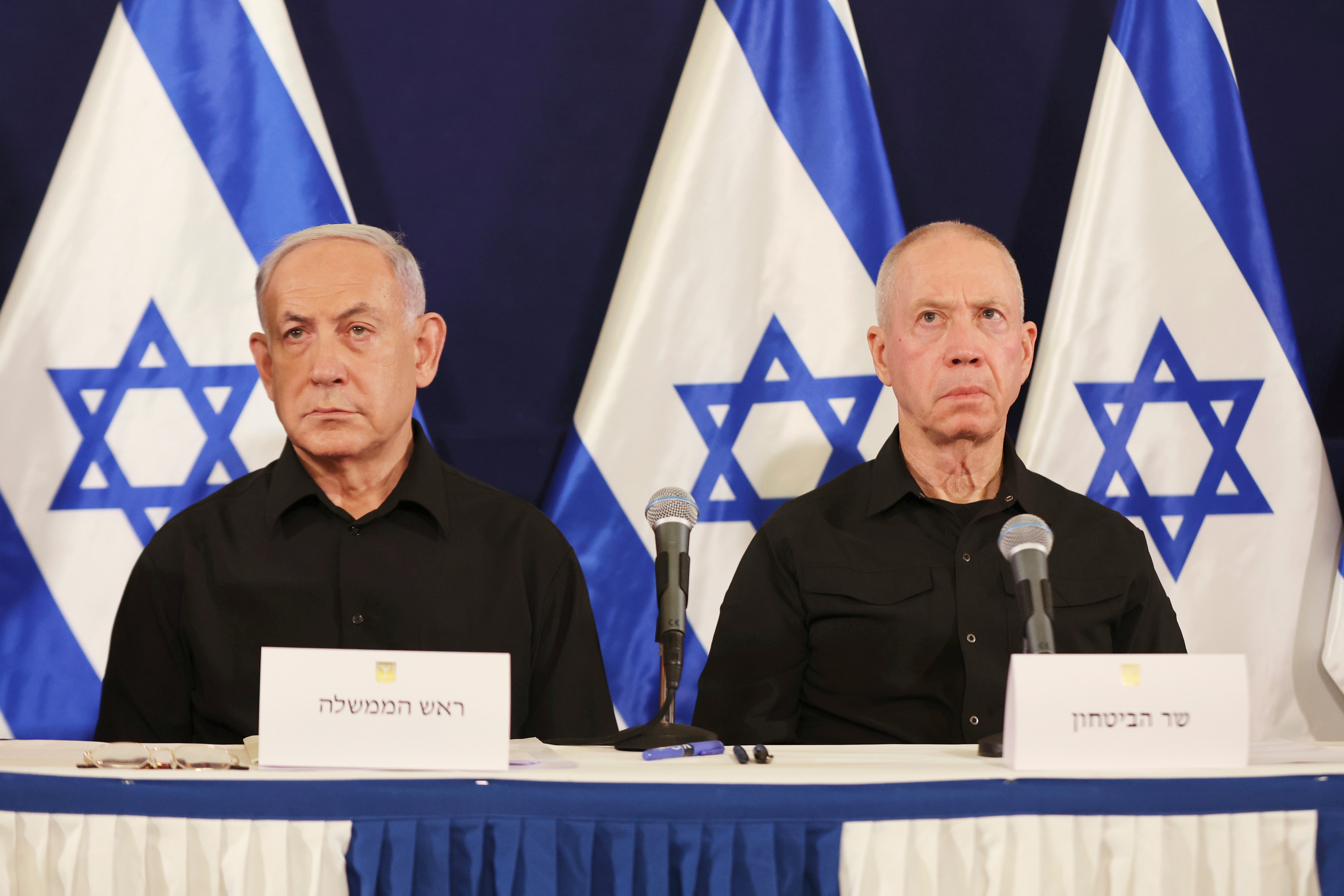 Israeli prime minister Benjamin Netanyahu, left and defence minister Yoav Gallant attend a press conference in the Kirya military base in Tel Aviv