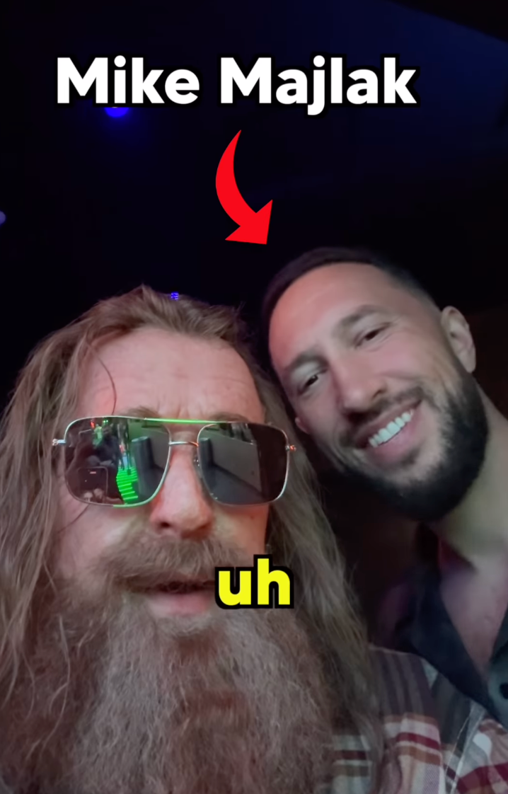 Paul poses with Mike Majlak, a co-host of his brother Logan Paul’s podcast