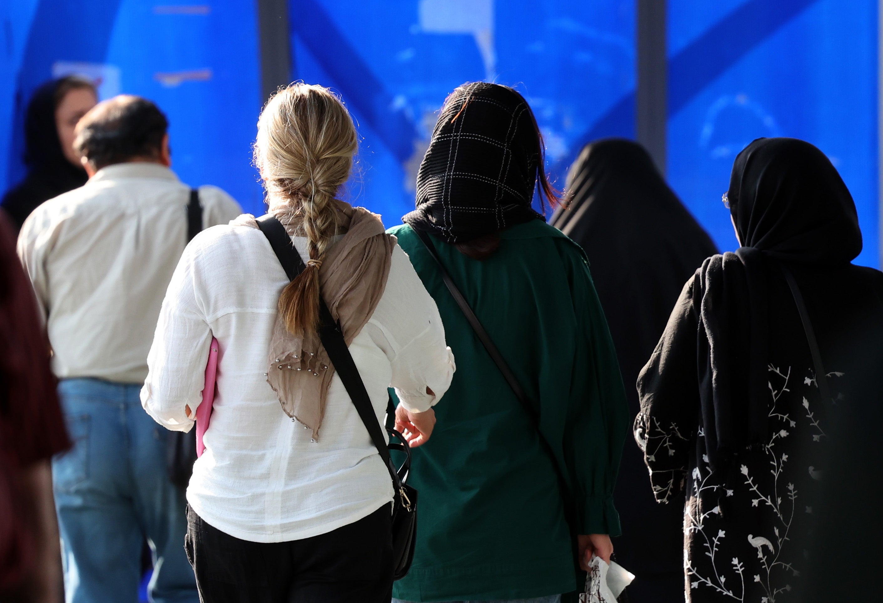 An Iranian woman without a mandatory headscarf, or hijab, walks in a street in Tehran, Iran, 15 September 2024, on the second anniversary of protests following Mahsa Amini's death